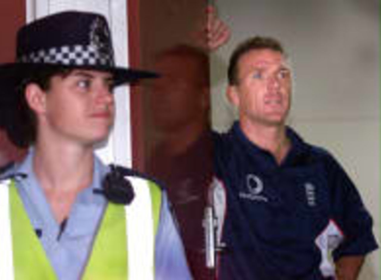 Stewart and a policewoman look out on a sodden MCG The Ashes, 1998/99, 4th Test Australia v England Melbourne Cricket Ground 26 December 1998