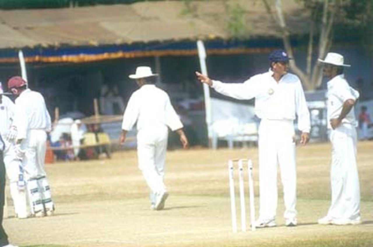 Captain Mohammad Azhar and Raju with their thinking caps on in between overs, Kerala v Hyderabad, Ranji Trophy (South Zone League) 1999/00, 24-27 November 1999 at Regional Engineering College Ground, Kozhikode.
