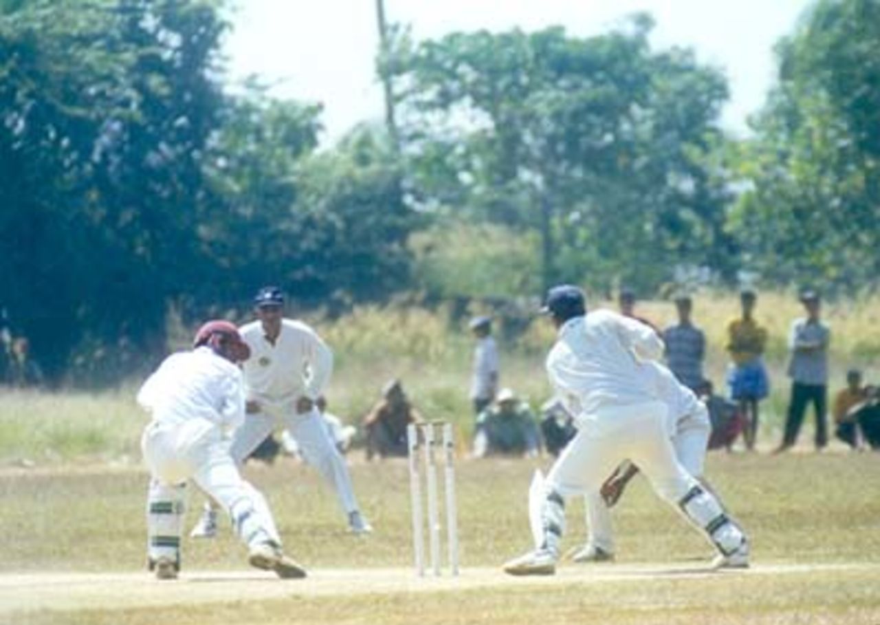 Shanker goes forward and watches one safely through into the gloves of Youraj Singh, Kerala v Hyderabad, Ranji Trophy (South Zone League) 1999/00, 24-27 November 1999 at Regional Engineering College Ground, Kozhikode.