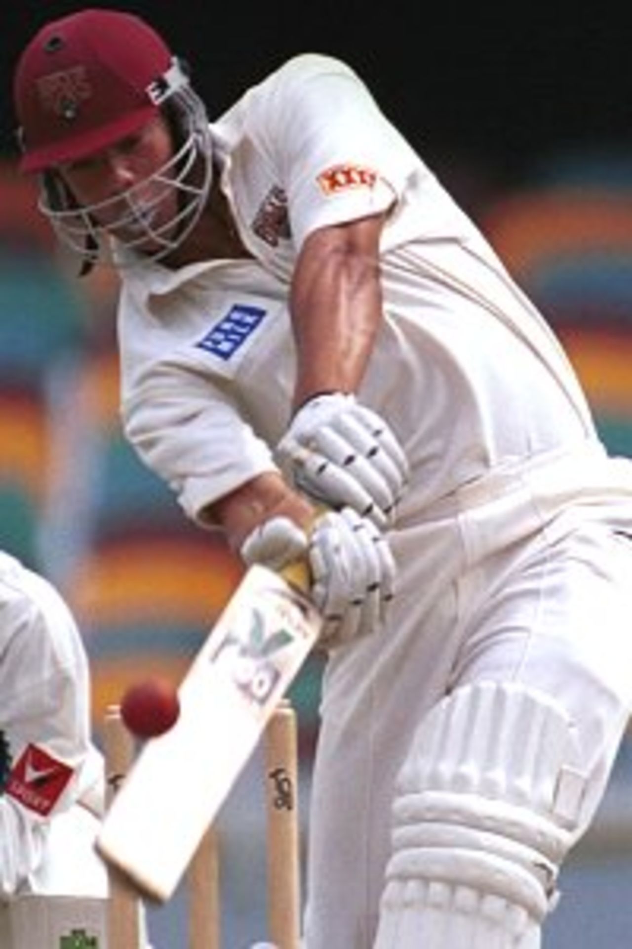 27 Nov 1999: Andrew Symonds of Queensland in action against India at the Gabba Cricket Ground in Brisbane,Australia.