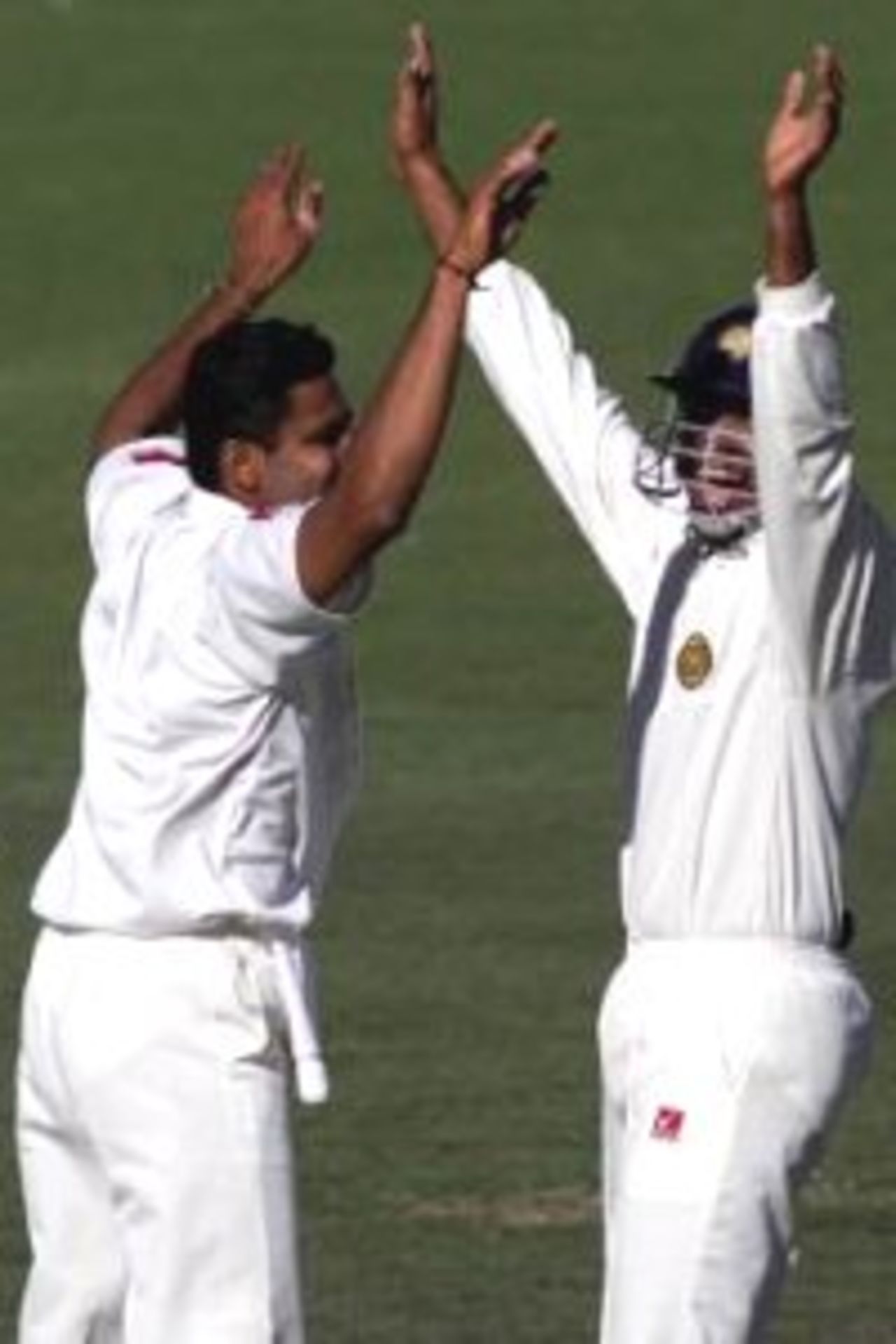 12 Dec 1999: Anil Kumble and Devang Gandhi of India celebrate after Gandhi caught Justin Langer of Australia off Kumble's bowling, on three of the first test between Australia and India, at the Adelaide Oval, Adelaide, Australia.