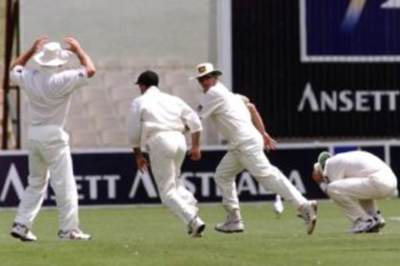 14 Dec 1999: Shane Warne of Australia holds his head after dropping a catch off an edge from Javagal Srinath of India from the bowling of Damien Fleming of Australia, while Fleming is on a hat trick, on day five of the first test between Australia and India, at the Adelaide Oval, Adelaide, Australia. Australia won by 285 runs.