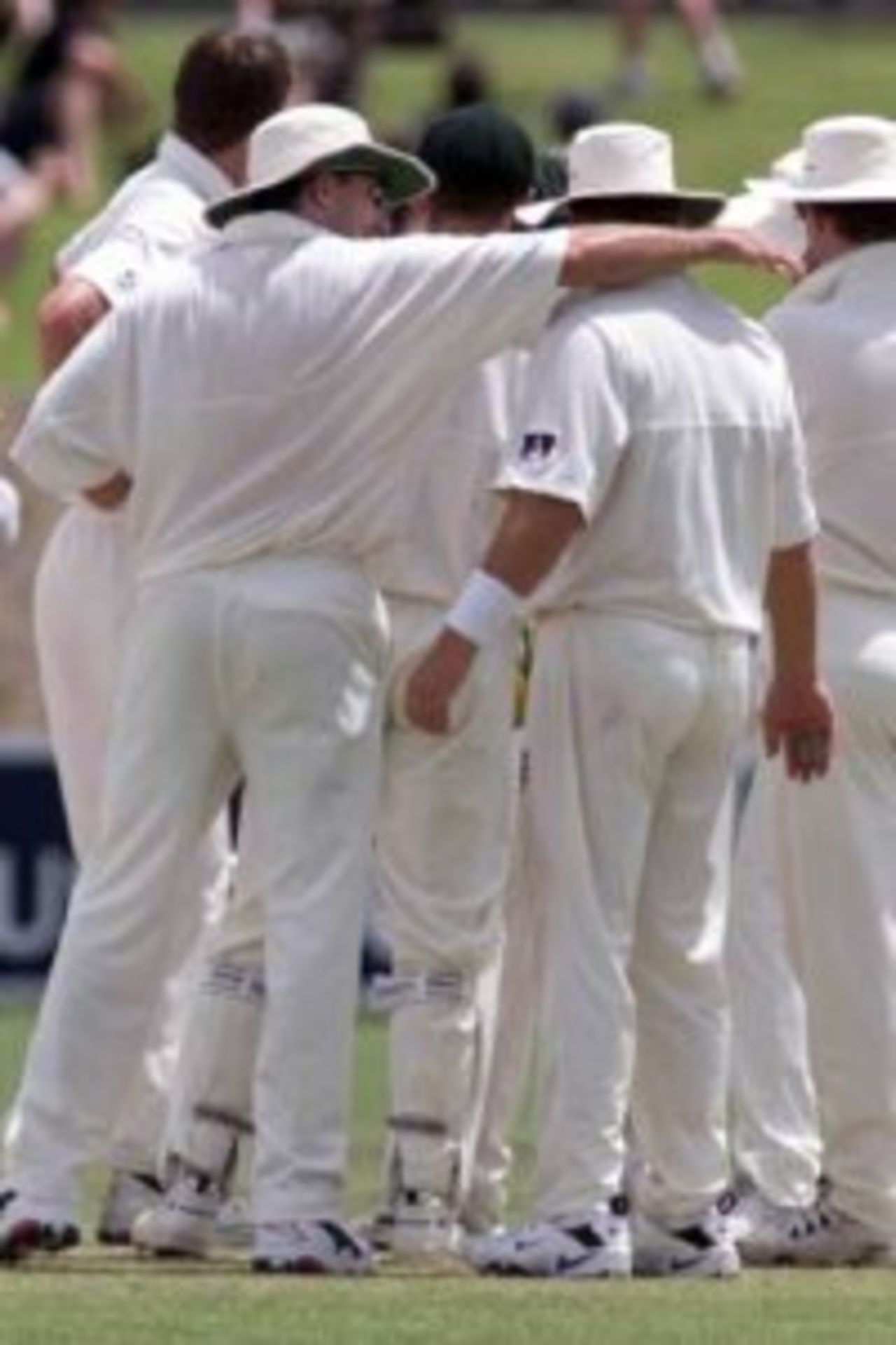 14 Dec 1999: Damien Fleming of Australia consoles Shane Warne after Warne dropped a catch off Fleming's bowling that would have given him a hat trick, on day five of the first test between Australia and India, at the Adelaide Oval, Adelaide, Australia. Australia won by 285 runs.