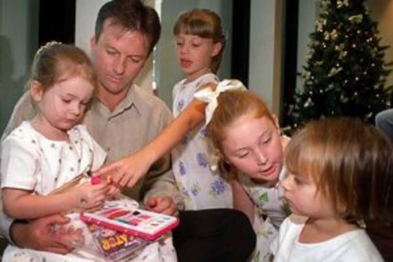 25 Dec 1999: Australian cricketer captain Stephen Waugh watches daughter, Rosealie play with other team members children during the Australian team's Christmas lunch at their team hotel this morning. Tommorrow Australia play India at the Melbourne Cricket Ground, Melbourne, Australia, in the Boxing Day Test Match.