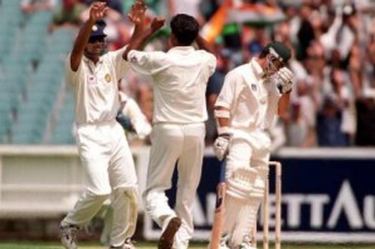 26 Dec 1999: Javagal Srinath of India celebrates the wicket of Justin Langer of Australia as Langer shows his disappointment, in the second test match between Australia and India, played at the Melbourne Cricket Ground, Melbourne, Australia. Srinath dismissed Langer lbw for 8 runs.
