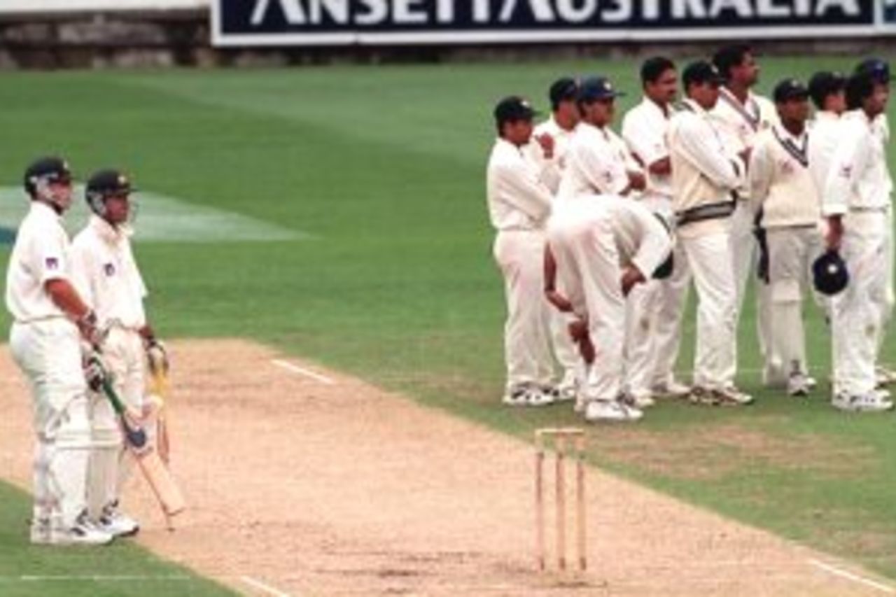 27 Dec 1999: Adam Gilchrist and Ricky Ponting of Australia, and the Indian team await the result from the 3rd umpire after an appeal for the dismissal of Adam Gilchrist, caught and bowled by Anil Kumble, on day two of the second test match between Australia and India, played at the Melbourne Cricket Ground, Melbourne, Australia. Gilchrist was judged not out.