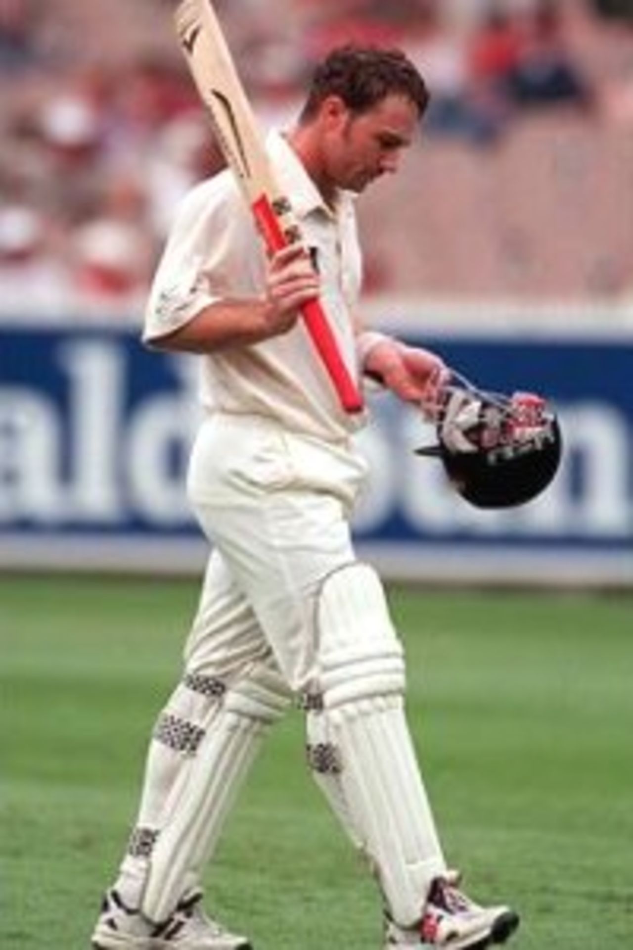 27 Dec 1999: Michael Slater of Australia leaves the field after being dismissed, on day two of the second test match between Australia and India, played at the Melbourne Cricket Ground, Melbourne, Australia. Slater was out for 91 runs.