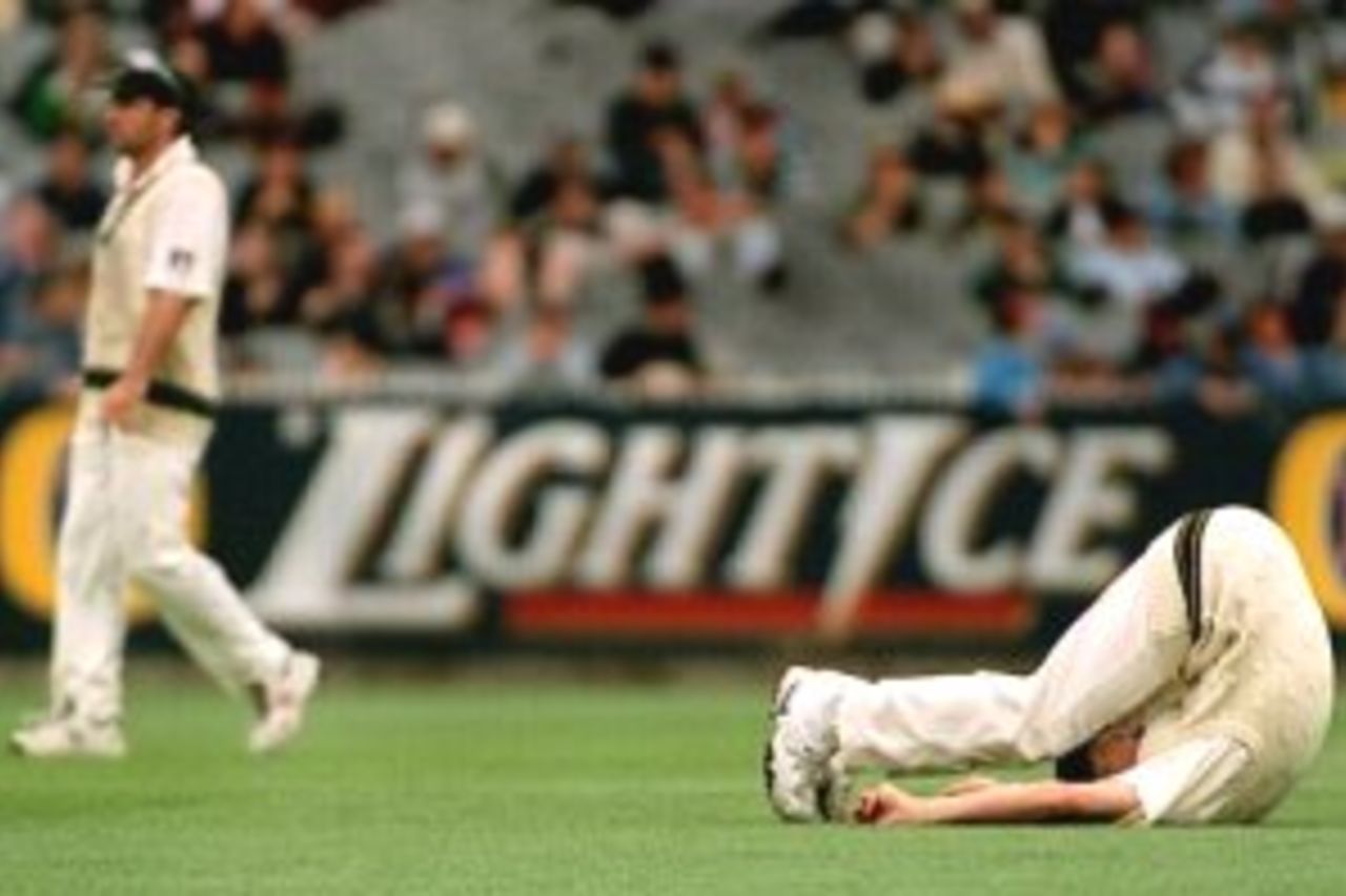 29 Dec 1999: Australian pace bowler Brett Lee limbers up in the out field before bowling on day four of the second test match between Australia and India, played at the Melbourne Cricket Ground, Melbourne, Australia. Australia later declared at five wickets for 208 runs.