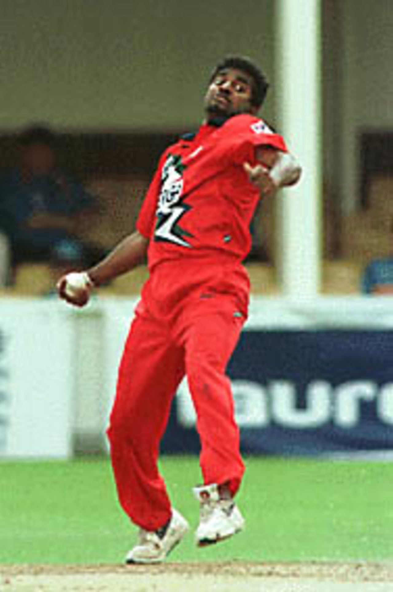 Muralitharan in his delivery stride, Warwickshire v Lancashire, National League 1st Division, 13 June 1999