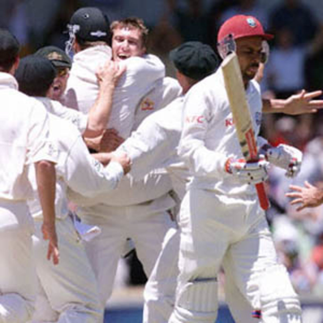 McGrath is congratulated by his teammates as he completes his hat-trick by removing Adams, The Frank Worrell Trophy, 2000/01, 2nd Test, Australia v West Indies, W.A.C.A. Ground, Perth, 01-05 December 2000 (Day 1).