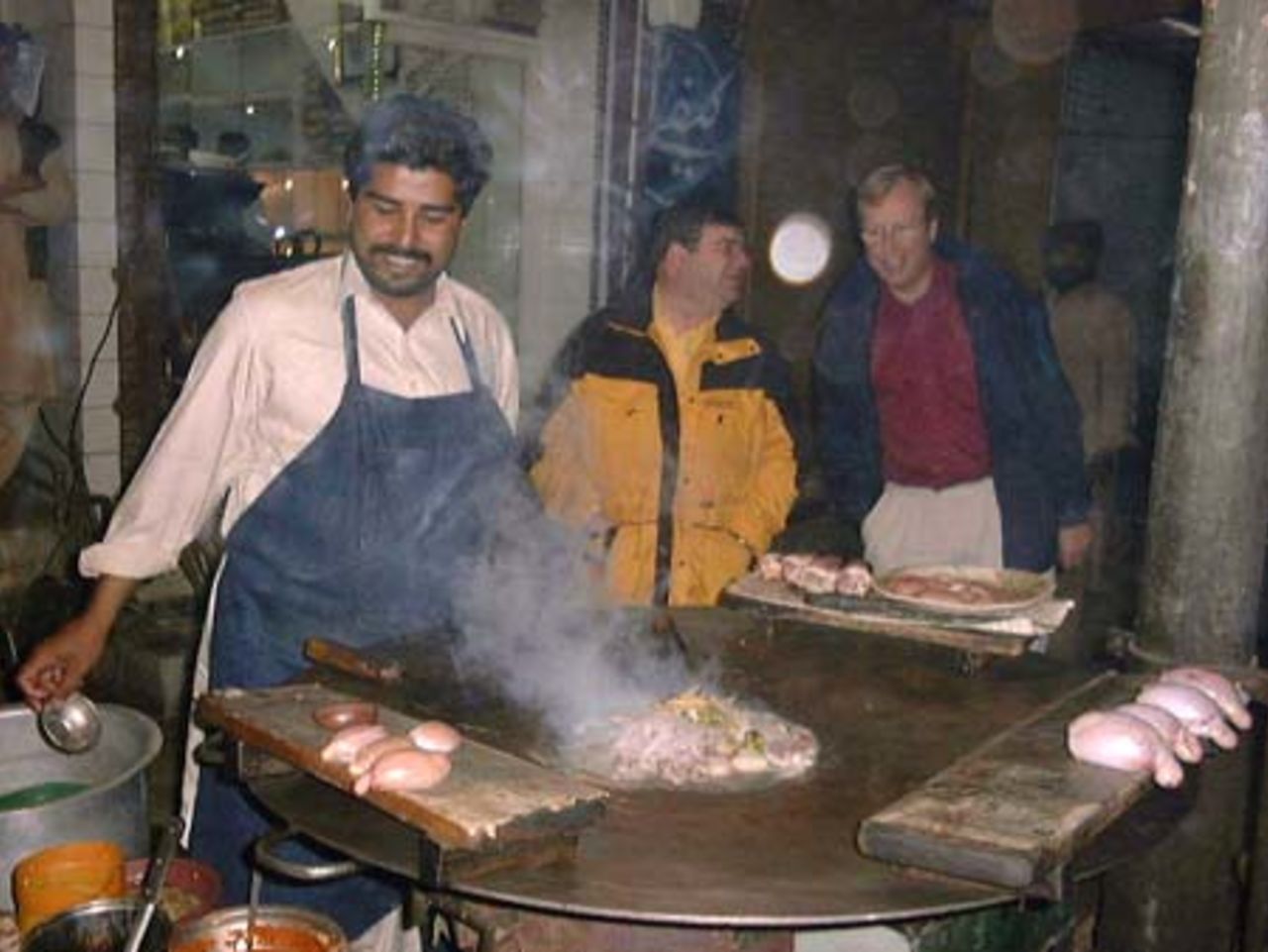 Victor Isaacs, Stephen Lamb of CricInfo making sure kat-e-kat is cooked properly at Faisalabad, 29 Nov-3 Dec 2000
