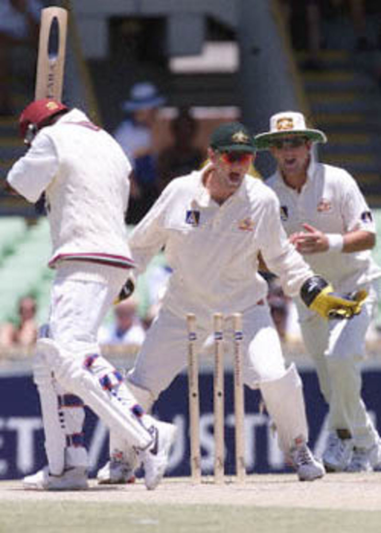 Adam Gilchrist's joy knows no bounds as Brian Lara is bowled by Stuart MacGill for 17, The Frank Worrell Trophy, 2000/01, 2nd Test, Australia v West Indies, W.A.C.A. Ground, Perth, 01-05 December 2000 (Day 3).