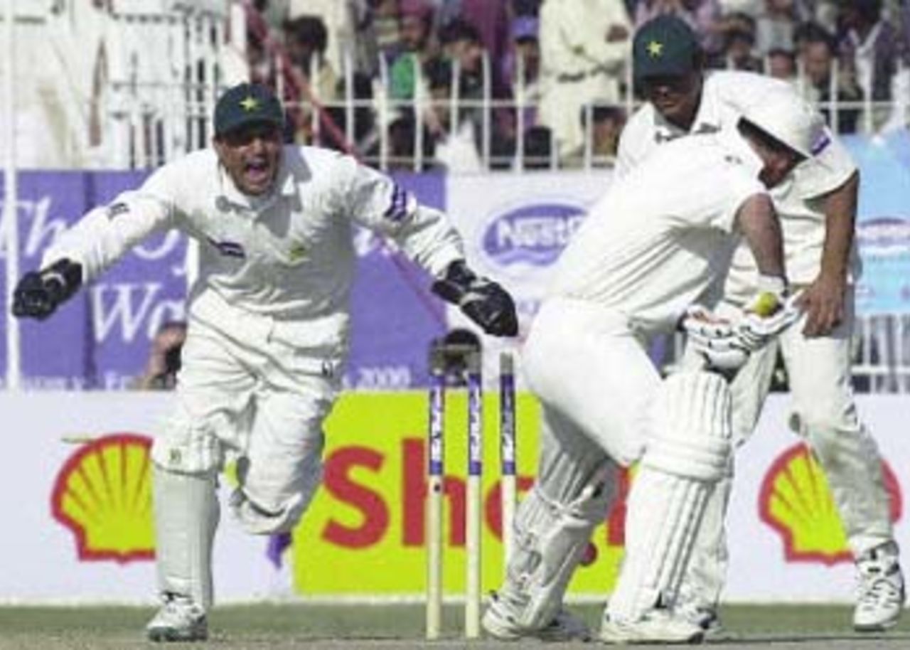 Moin Khan is all smiles after Arshad Khan disturbs Graham Thorpe's stumps, England in Pakistan, 2000/01, 2nd Test, Pakistan v England, Iqbal Stadium, Faisalabad, 29Nov-03Dec 2000 (Day 5).