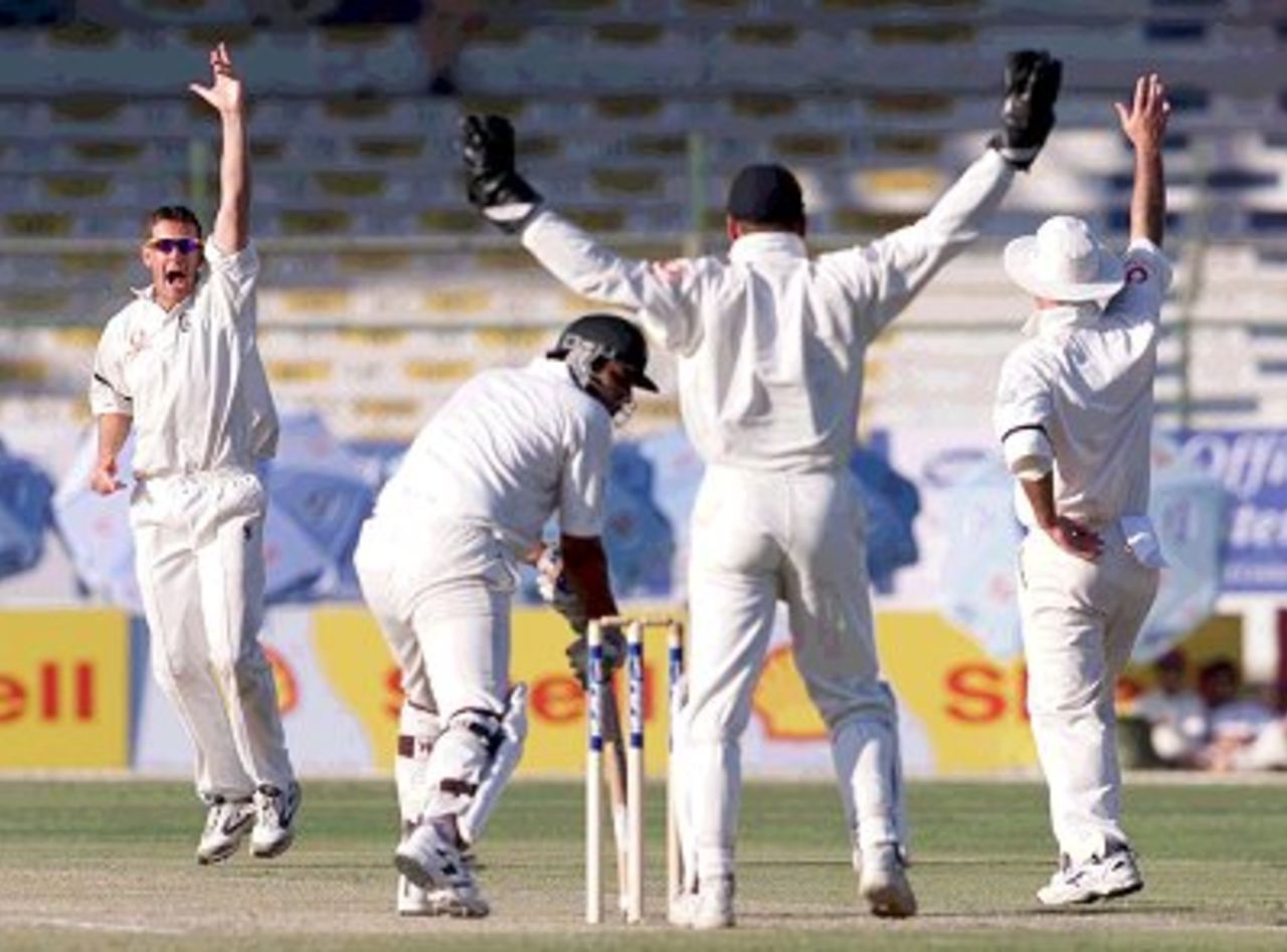 7 Dec 2000: Ashley Giles of England puts in a desperate appeal against Inzaman Ul-Haq of Pakistan during the third and final test match at the National Stadium in Karachi, Pakistan.