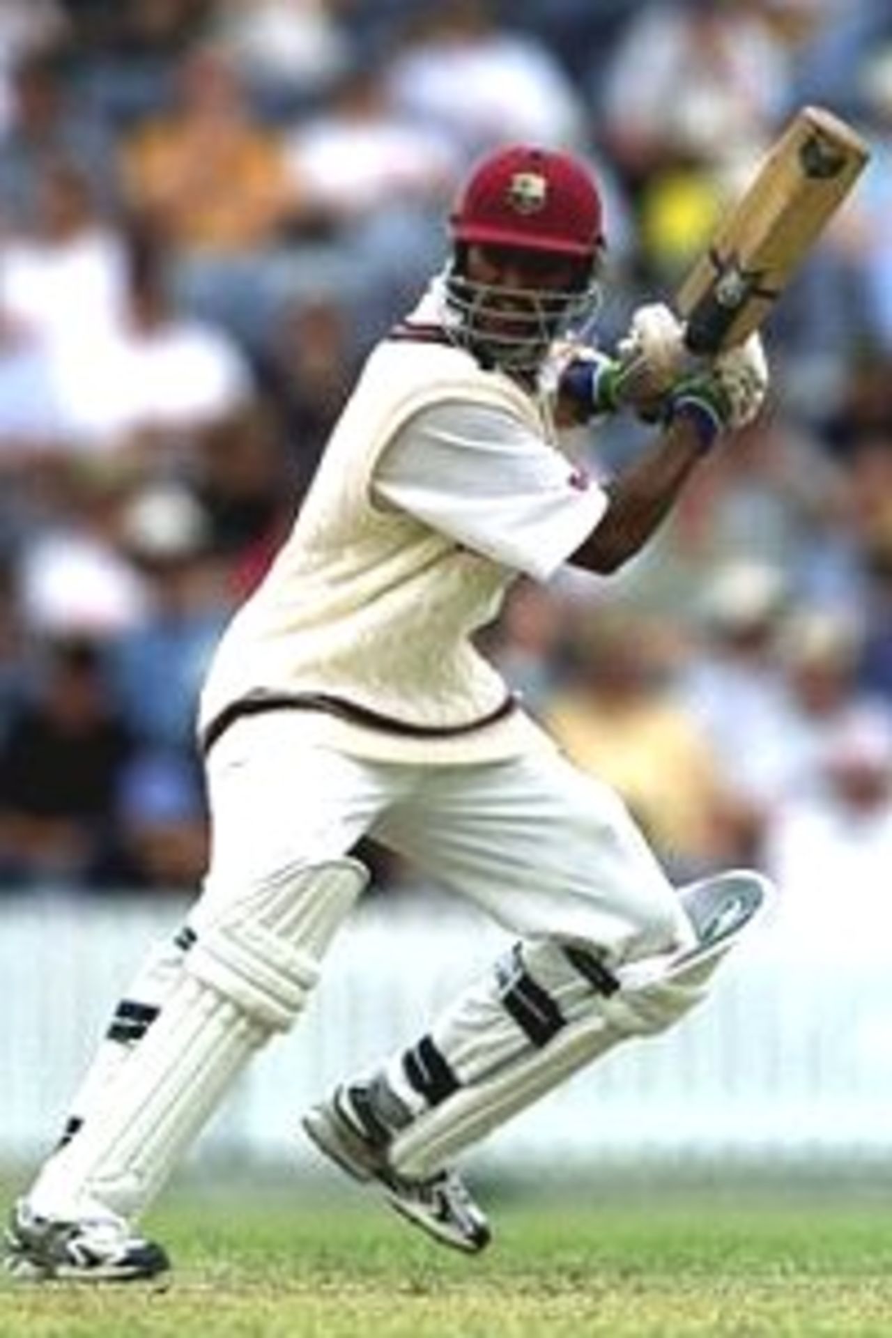 Daren Ganga of the West Indies drives during his innings of 97 against the Prime Ministers X1 during the one day cricket game between the Prime Ministers X1 and the West Indies at the Manuka Oval, Canberra, Australia.