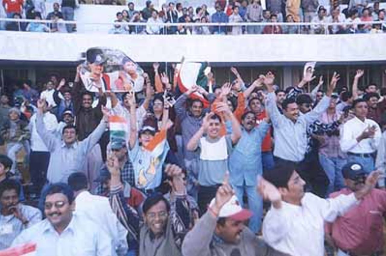 Spectators supporting India by displaying the tricolour, Zimbabwe in India, 2000/01, 2nd One-Day International, India v Zimbabwe, Sardar Patel (Gujarat) Stadium, Motera, Ahmedabad, 05 December 2000.