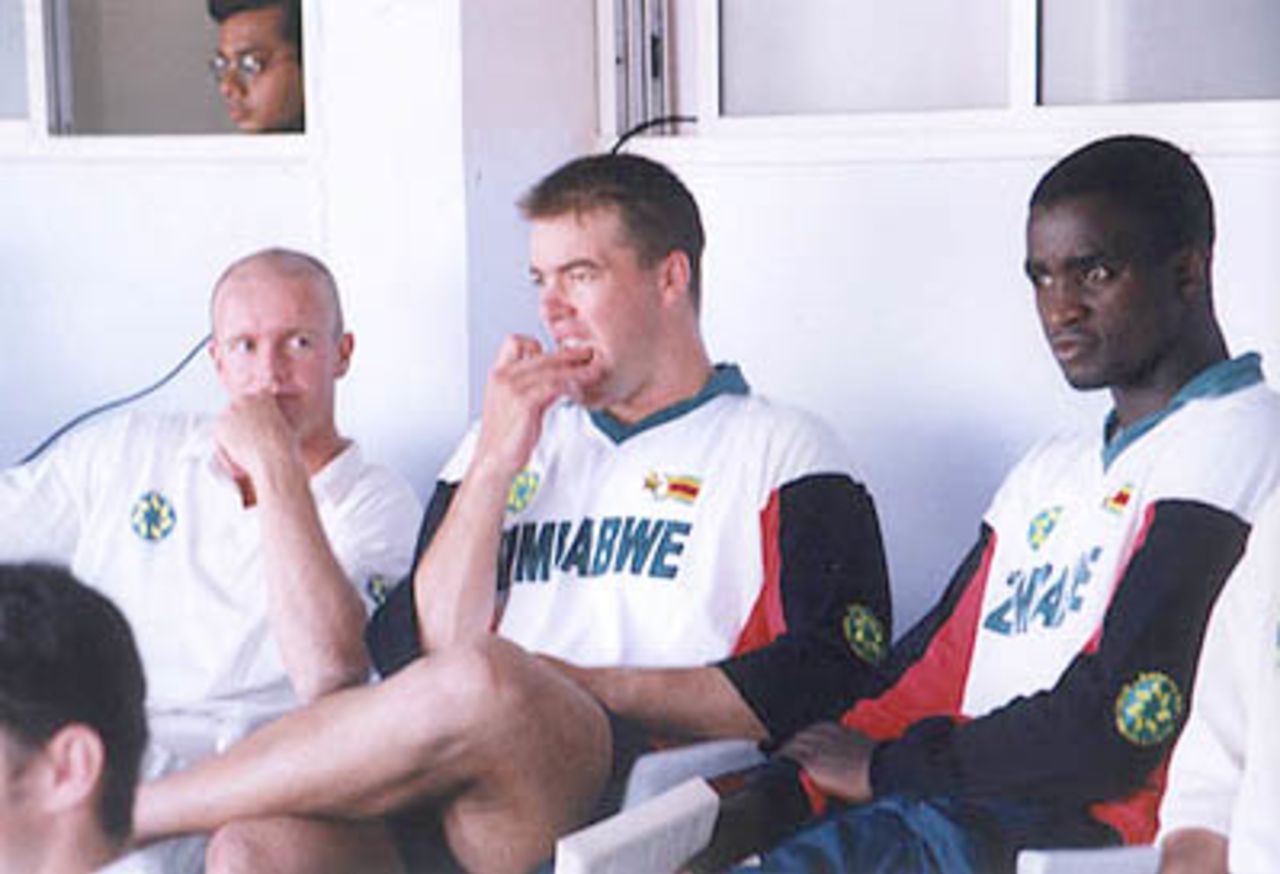 Streak, G Flower and Nkala in the Zimbabwean dressing room, Zimbabwe in India, 2000/01, 2nd One-Day International, India v Zimbabwe, Sardar Patel (Gujarat) Stadium, Motera, Ahmedabad, 05 December 2000.