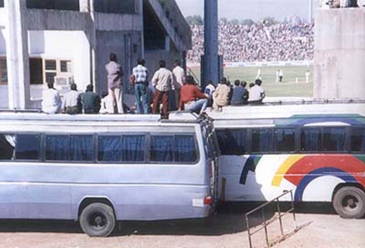 A section of the  public watching the match from the top of bus, Zimbabwe in India, 2000/01, 2nd One-Day International, India v Zimbabwe, Sardar Patel (Gujarat) Stadium, Motera, Ahmedabad, 05 December 2000.