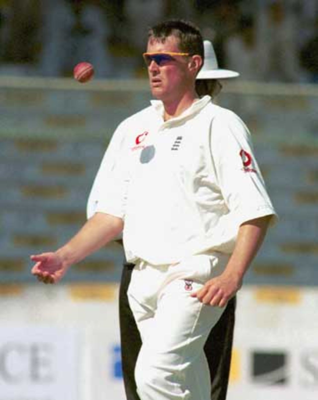 Ashley Giles flips the ball as he walks to his bowling mark, Day 2, 3rd Test Match, Pakistan v England at Karachi, 29 Nov-3 Dec 2000.