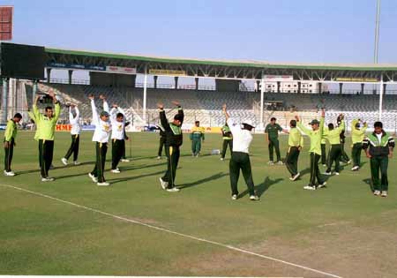 The home team - preparing themselves for the day, Day 4, 3rd Test Match, Pakistan v England at Karachi, 7 Dec-11 Dec 2000.