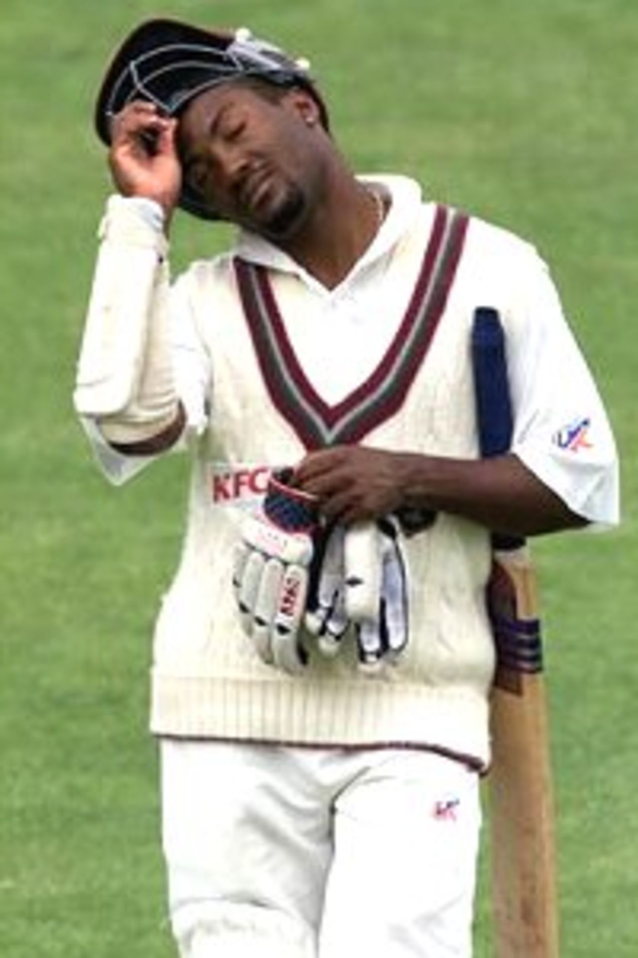 11 Dec 2000: Brian Lara of the West Indies leaves the field after being caught by Martin Love of Australia A off the bowling of Brad Hodge for 231, during day three of the four day tour match between Australia A and the West Indies, at Bellerive Oval, Hobart, Australia.