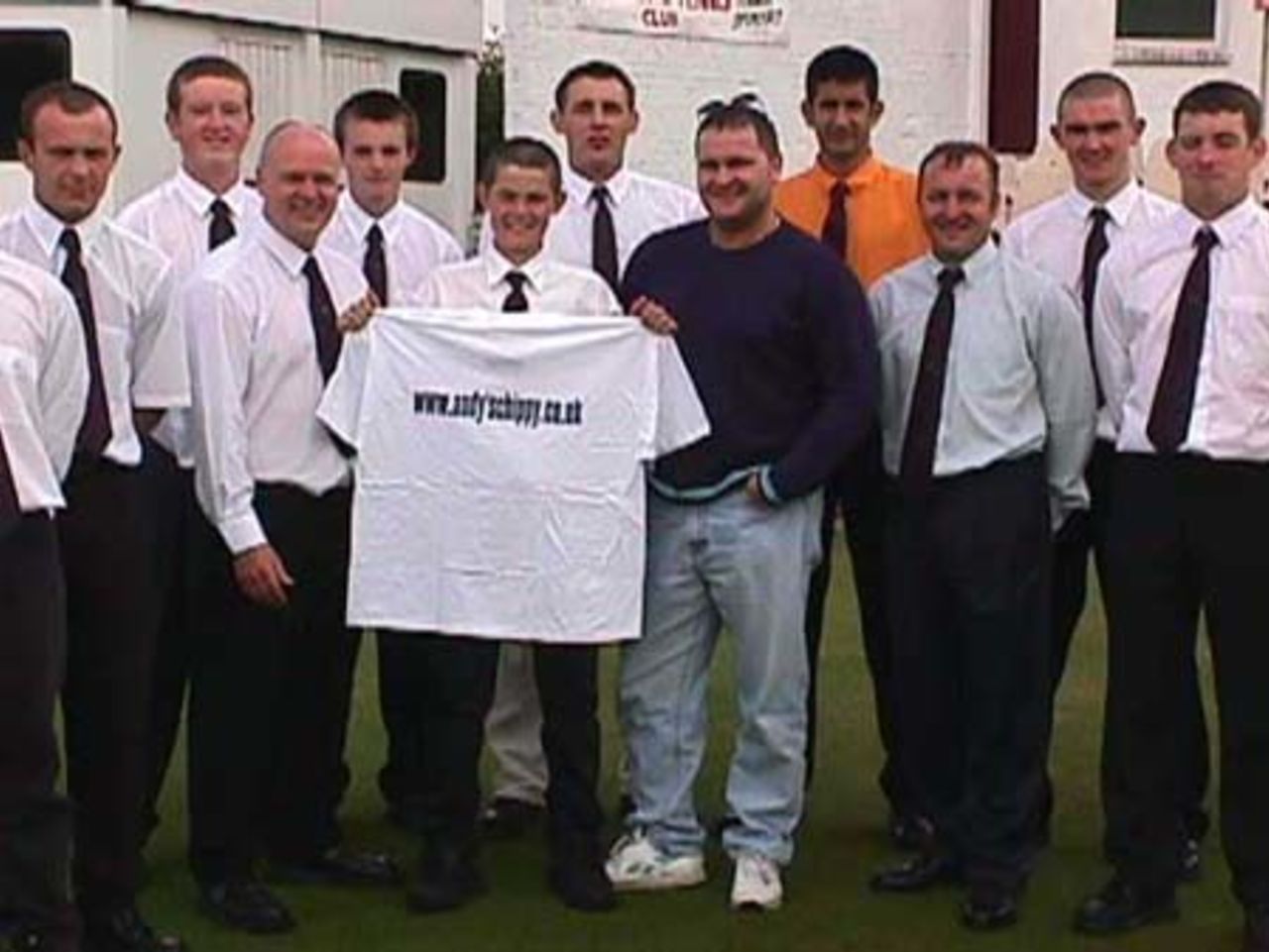 Richard Chaplow trying on one of sponsor Andy's Chippy's t - shirts for size