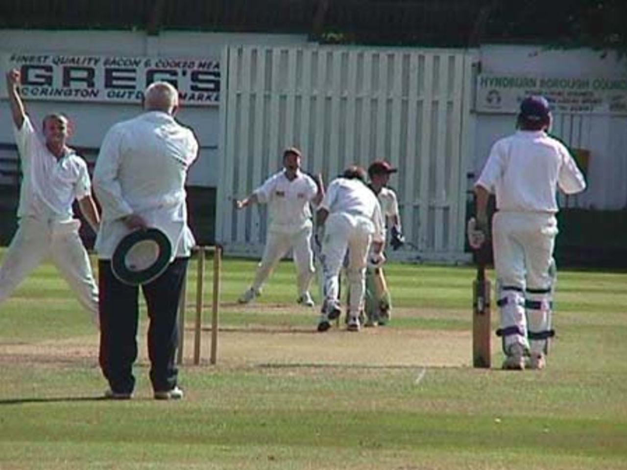 Umpire Les Parrington about to end Church's Dave Gilrane's afternoon