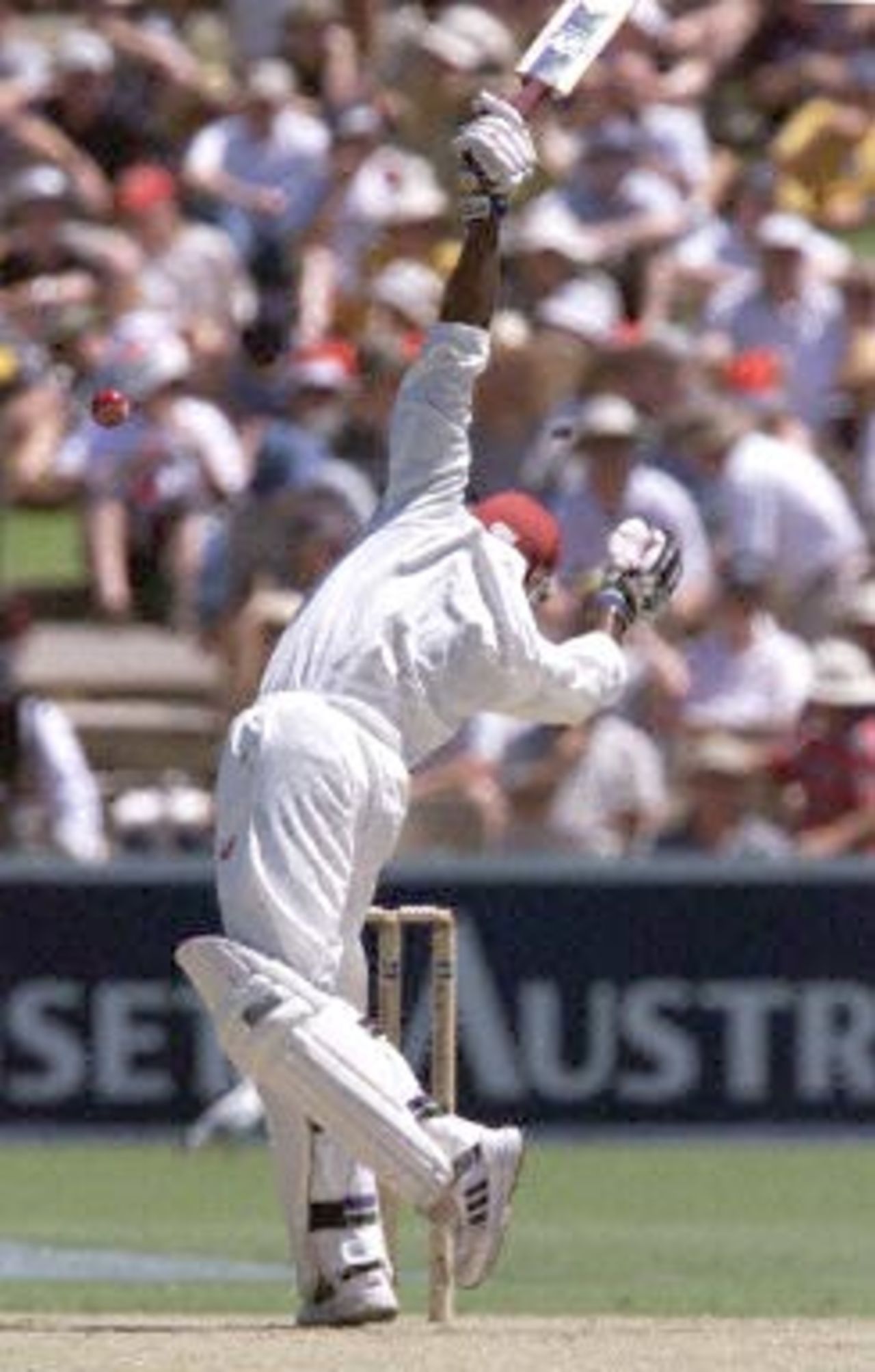 West Indies opening batsman Sherwin Campbell takes evasive action from a bouncer delivered by fast bowler Glenn McGrath during the first day of the third test against the West Indies at the Adelaide oval 15 December 2000. At lunch the West Indies are 2 for 61 runs, with Australia currently leading the five test series against the West Indies 2-0.