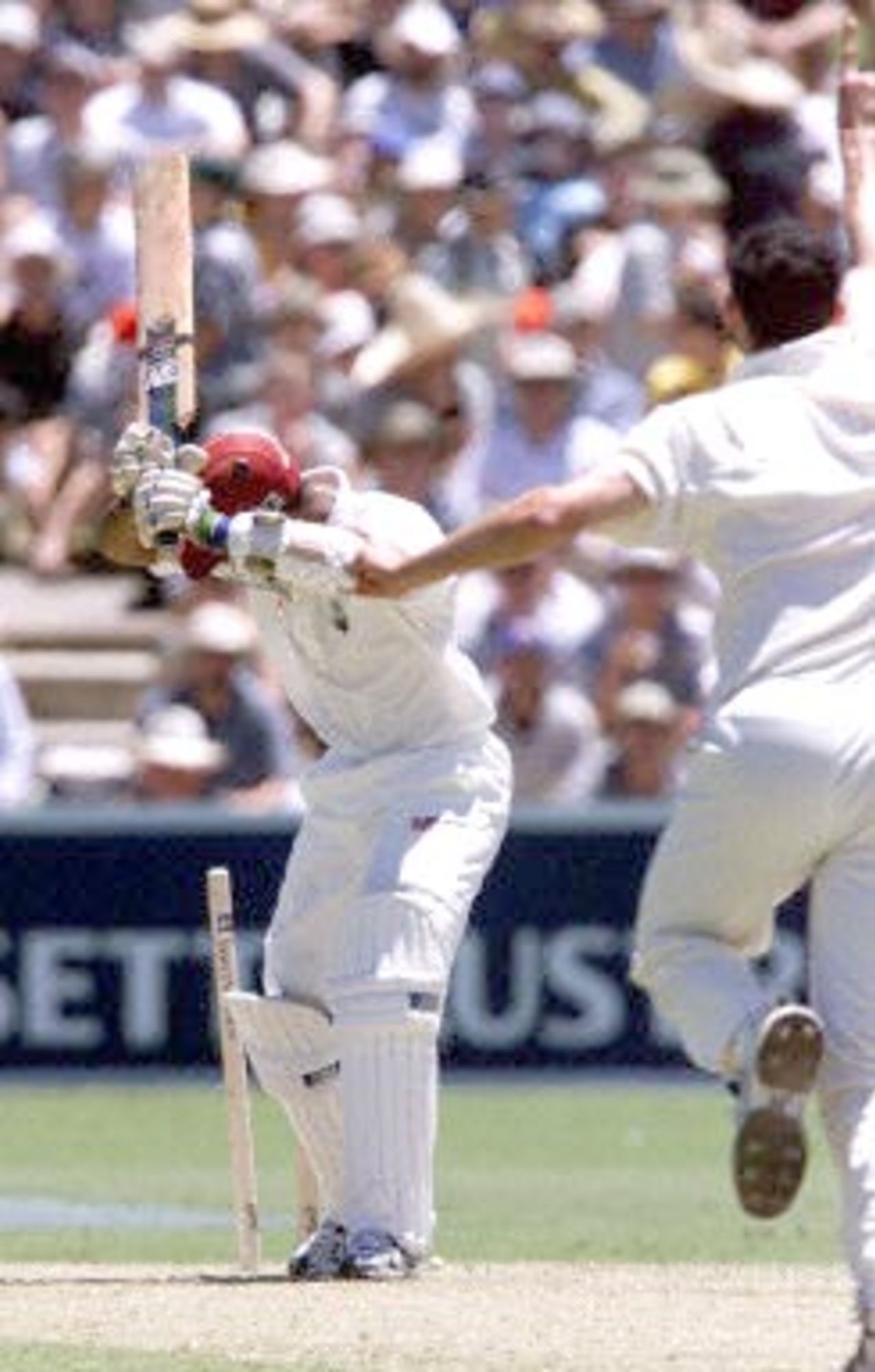 West Indies opening batsman Daren Ganga is bowled by Australian paceman Jason Gillespie for 23 runs, during the first day of the third test against the West Indies at the Adelaide oval 15 December 2000. At lunch the West Indies are 2 for 61 runs, with Australia currently leading the five test series against the West Indies 2-0.