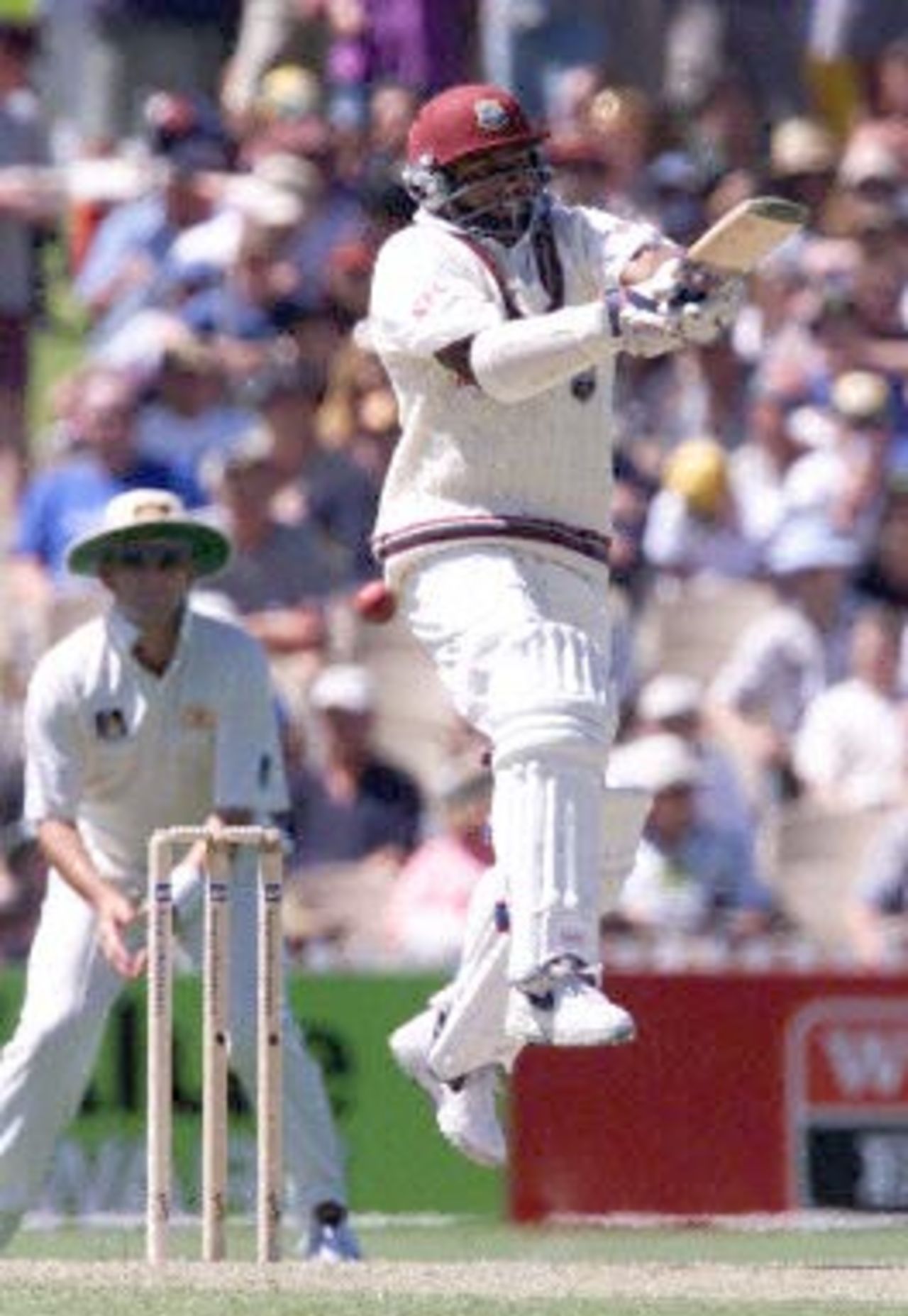 West Indies batsman Brian Lara jumps in the air as he attempts to pull a ball from Australian fast bowler Glenn McGrath during the first day of the third test against the West Indies at the Adelaide oval 15 December 2000. Lara is 59 not out at tea, with the West Indies 3 for 146.