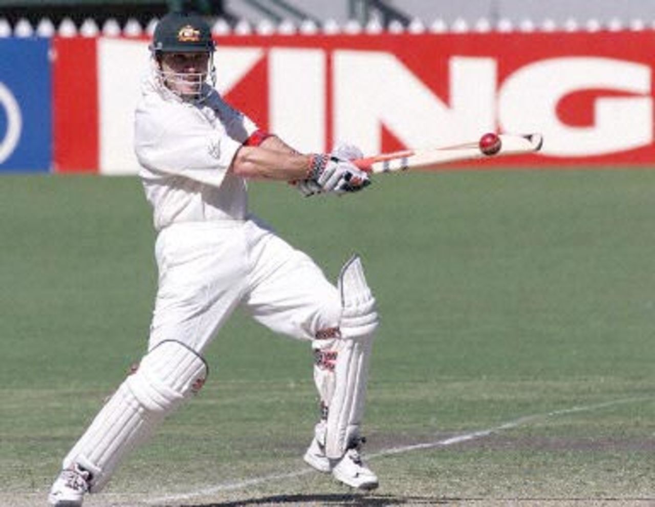 Australian batsman Michael Slater cuts a delivery from West Indies bowler Courtney Walsh for four runs, on day two of the third test match at the Adelaide oval 16 December 2000. Slater was out on 83, as Australia finished the days play three wickets for 180, chasing the West Indies first innings score of 391.
