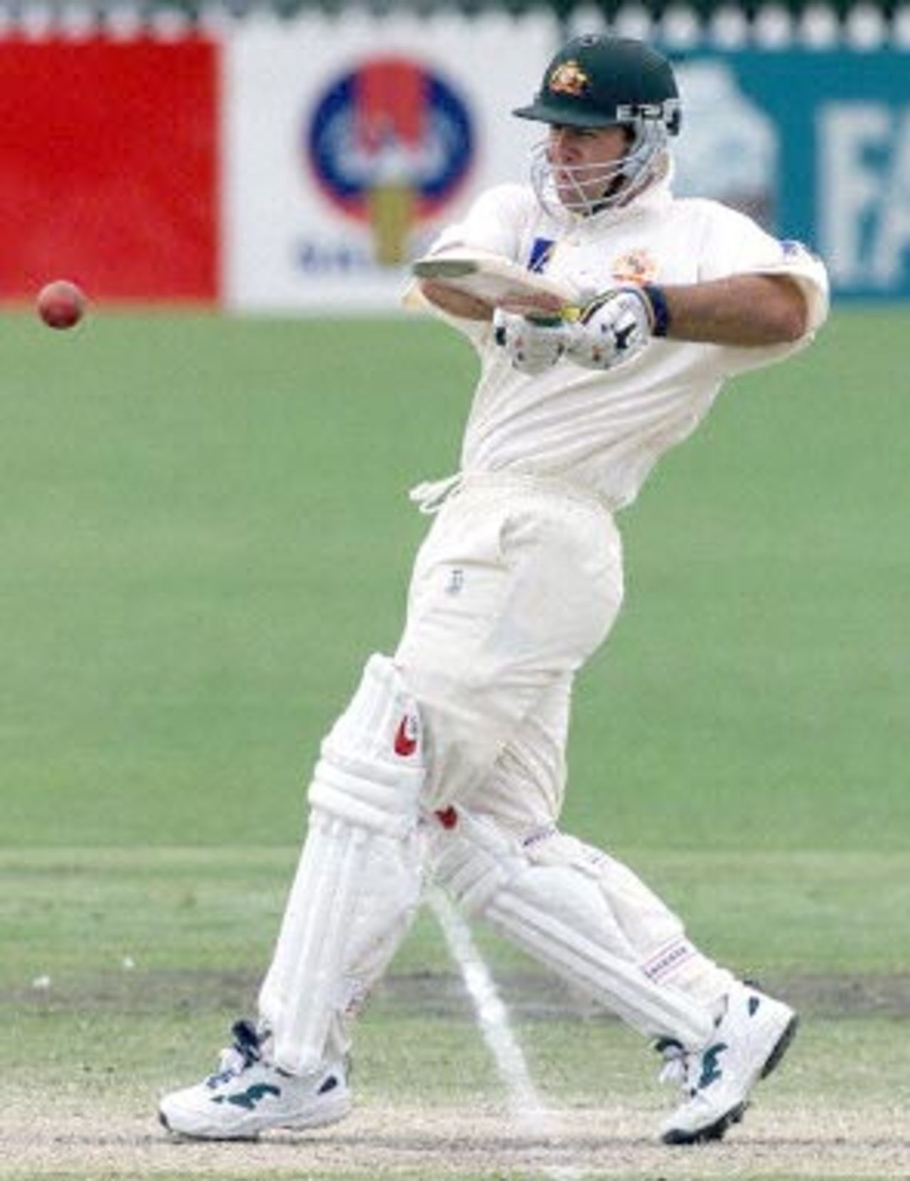Australian batsman Ricky Ponting pulls the ball to the boundary on day three of the third test match against the West Indies at the Adelaide oval 17 December 2000. At lunch Australia are four for 266, chasing the West Indies first innings score of 391, with Ponting on 47 not out and Mark Waugh not out on 44.