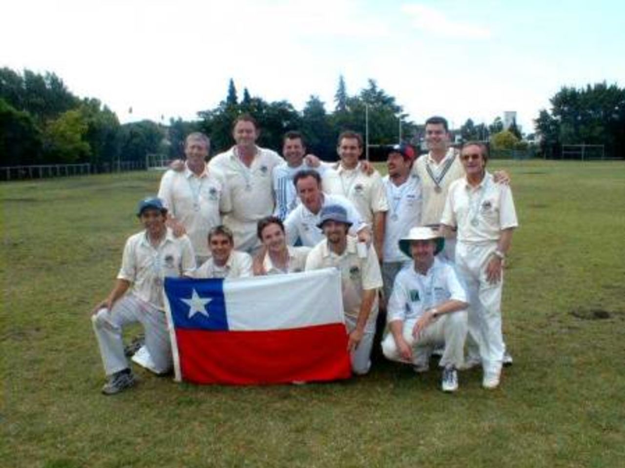 Chile with their Silver Medals: <br>Back Row: Nick Green, Clive Marriott, Ian Scott, Mike Meade, Ian Walker, Guy Hooper, Tony Adams, <br>Front Row: Enrique Valenzuela, Creighton Meade, Hamish Mackenzie, Stuart Nelson(Cpt), Tim Messner, David Cockcroft