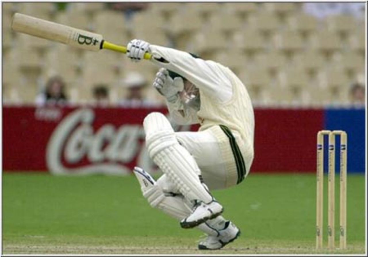 MacGill ducks trying to avoid a delivery from Dillon, but is caught for six, Australia v West Indies, 3rd Test in the 2000/01 series played at the Adelaide Oval, December 2000
