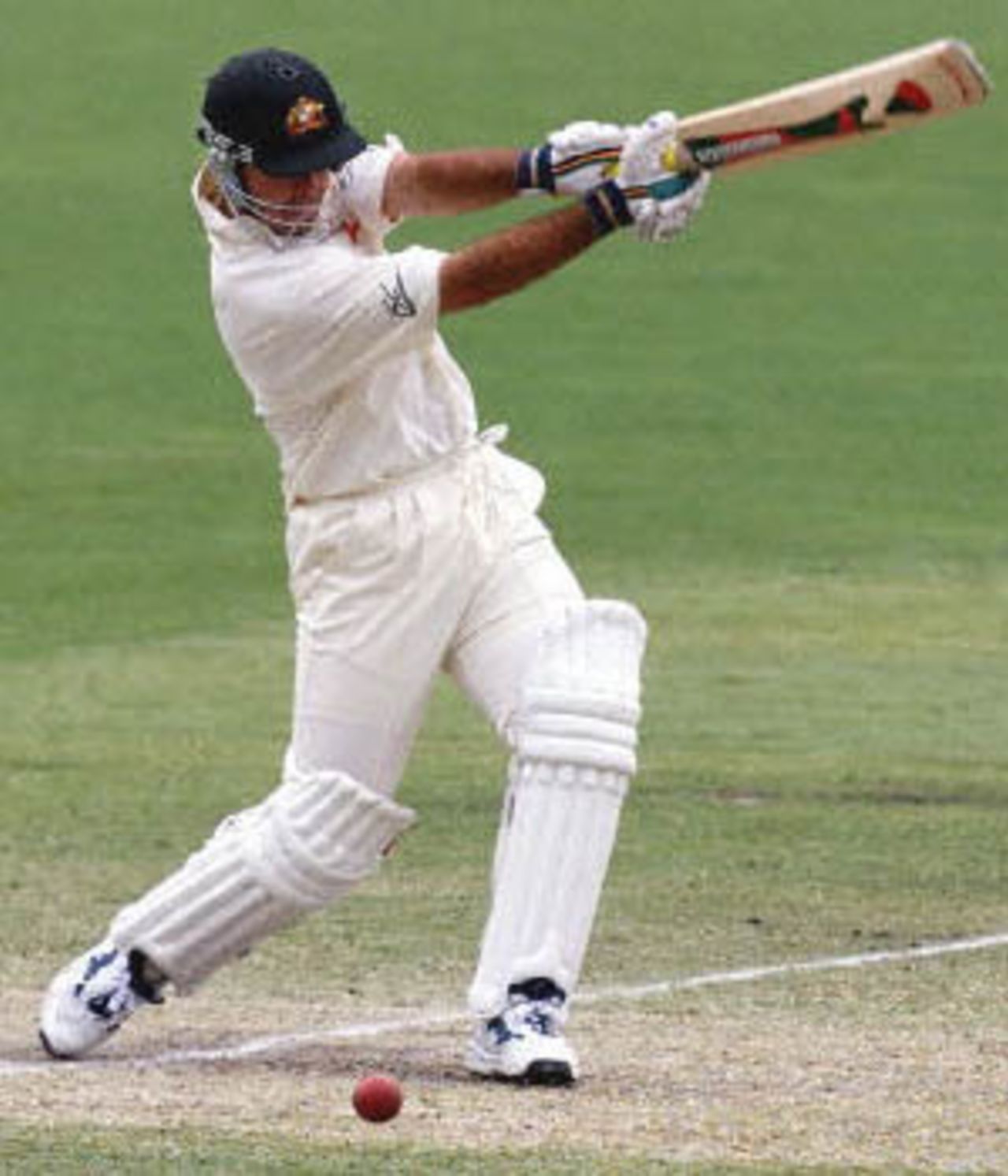 Australian batsman Ricky Ponting drives the ball on day three of the third Test match against the West Indies at the Adelaide Oval, 17 December 2000. Ponting was out for 92 runs off the bowling of Courtney Walsh with Australia currently on six for 379 chasing the West Indies first innings score of 391.