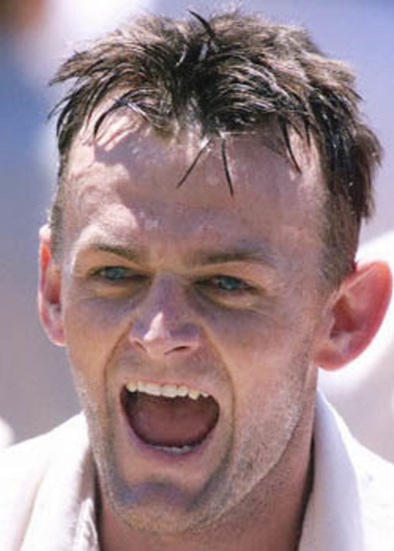 Australian test cricket captain Adam Gilchrist shouts in triumph as he leaves the field after leading his side to a five wicket win against the West Indies in the third test at the Adelaide Oval, 19 December 2000. The win is the first for stand-in captain Gilchrist who replaced the injured Steve Waugh for this match, and extends Australia's world record unbeaten run to 13.