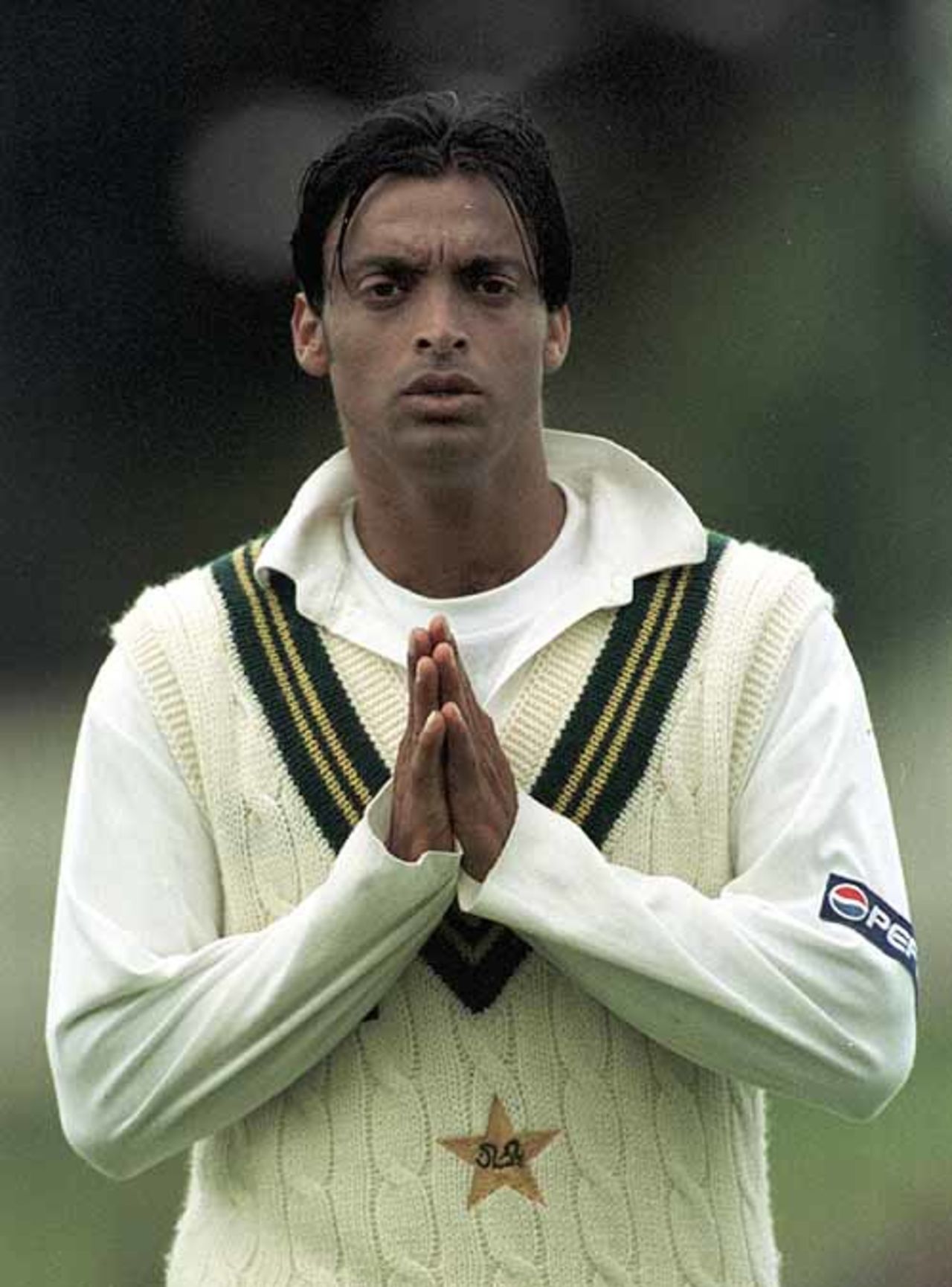18 Nov 1999: Pakistan fast bowler Shoaib Akhtar prays for a better showing tommorrow as he leaves the field after the first day's play of the of the Second test match between Australia and Pakistan at Bellerive Oval, Hobart, Australia. Australia finished the day at none for twenty nine after bowling out Pakistan for 222.