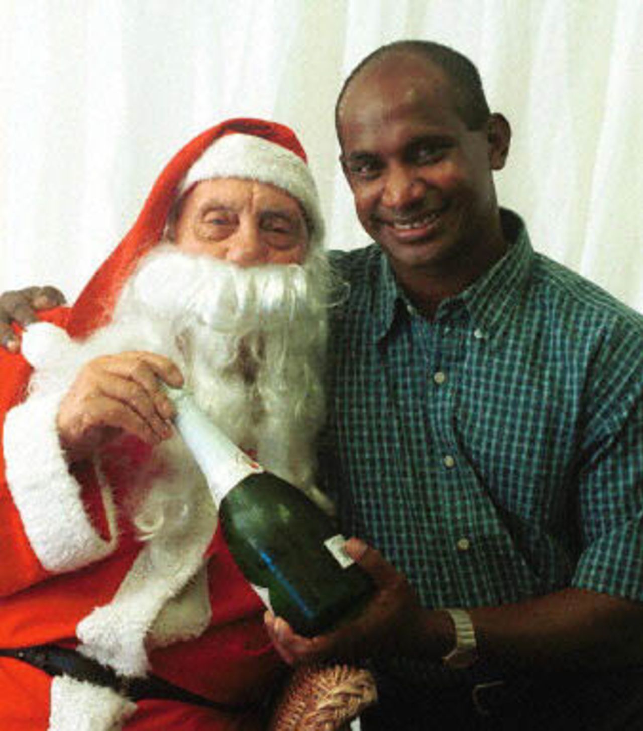 Sri Lankan cricket captain and opening batsman Sanath Jayasuriya request a wish from Santa Clause, Walter Keeble, at the Holiday Inn Hotel 25 December 2000 to beat the South Africans at the start of the first cricket Test match beginnig 26 December 2000 at Durban's Kingsmead Cricket stadium.