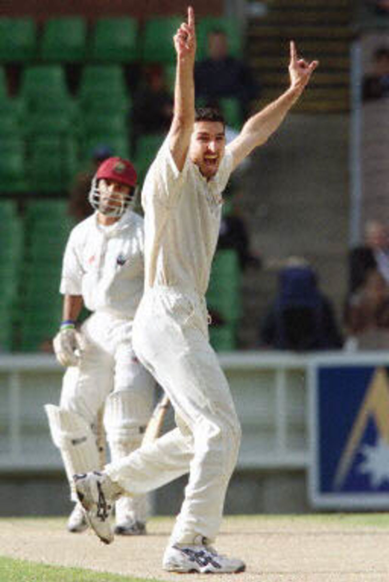 Australian paceman Jason Gillespie (R) appeals successfully for the wicket of West Indian batsman Daren Ganga (L) late on the third day of the fourth Test Match at the MCG in Melbourne, 28 December 2000. Australia declared their second innings close at 262-5 and at stumps the West Indies are again in deep trouble at 10-3 chasing 462 to win.