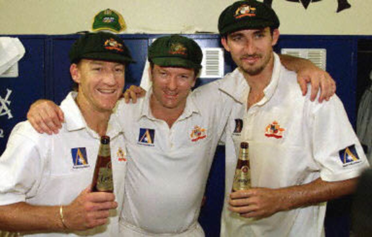 Australian pacemen Jason Gillespie (R) and Andrew Bichel (L) are congratulated by Steve Waugh (C) on a match winning performance at the MCG in Melbourne, 29 December 2000. Australia won the match by 352 run with Gillespie demolishing the West Indies taking 6-40. Australia lead the series 4-0 and extend their world record winning run to fourteen consecutive victories.