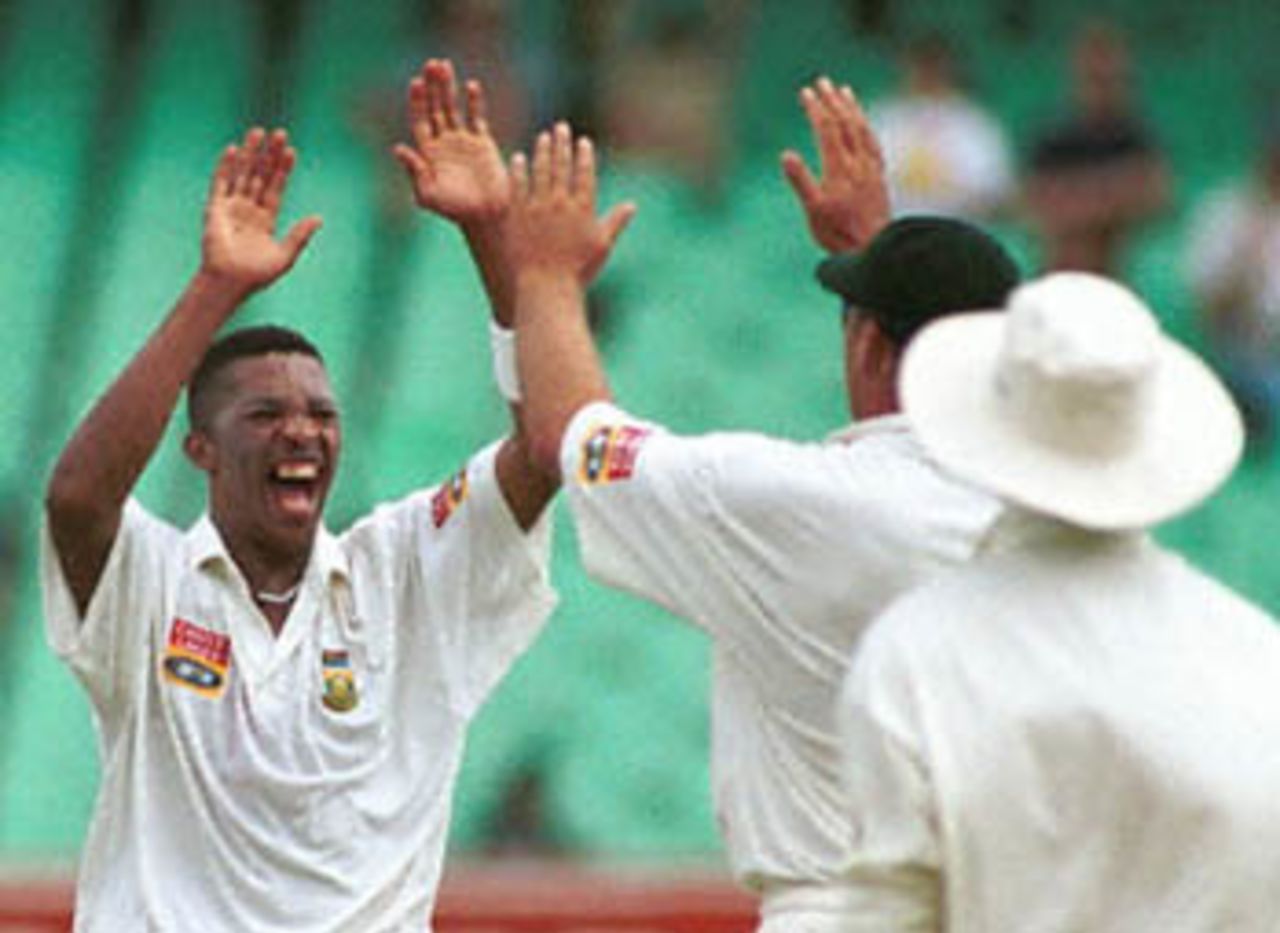 South African paceman Makhaya Ntini celebrates after taking the wicket of Sri Lankan wicket keeper Romesh Kaluwitharana, 28 December 2000 at Durban's Kingsmead cricket grounds, during the third day of the first Test match between South Africa and Sri Lanka.