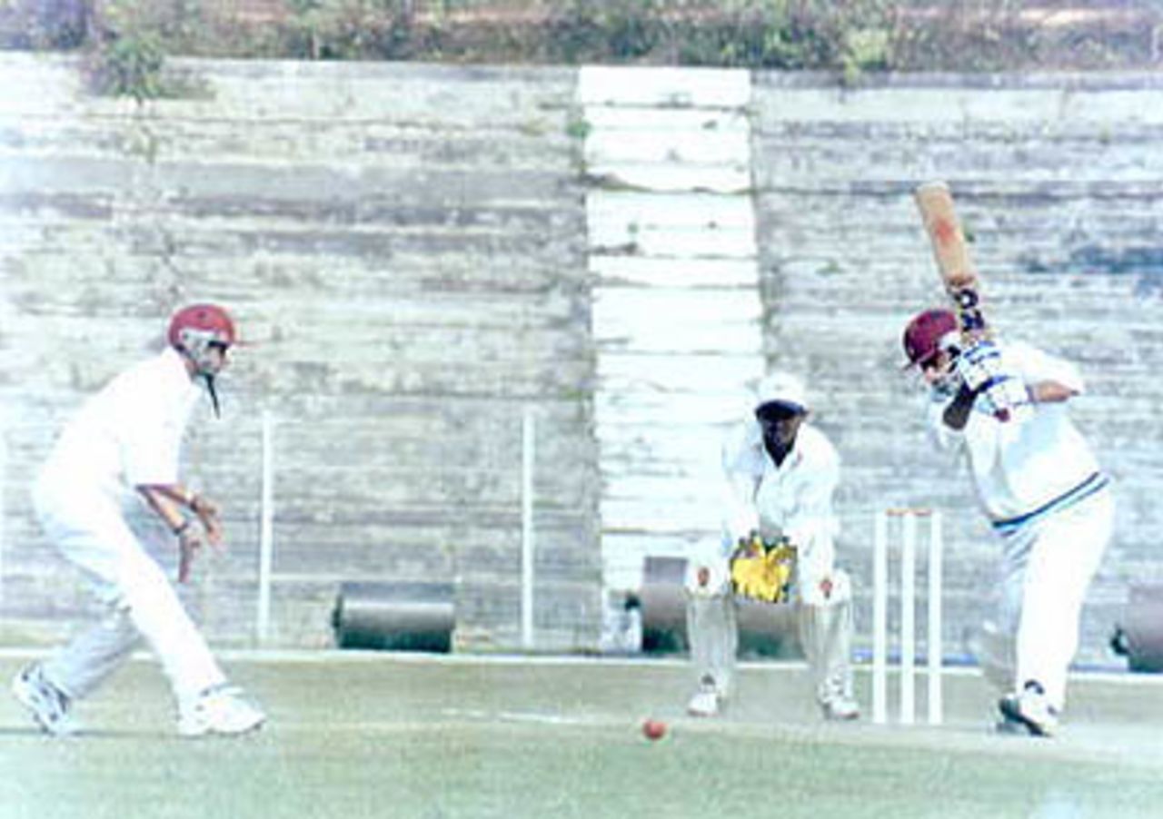 Ganesh Kumar plays the off drive. Ranji Trophy East Zone League, 2000/01, Tripura v Assam, Maharaja Bir Bikram College Stadium, Agartala, 14-16 December 2000.