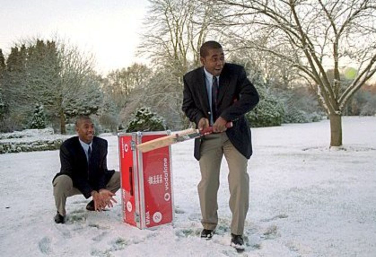 28 Dec 2000: England A Captain Mark Alleyne and Alex Tudor play cricket in the snow as they wait to depart for the Carribean winter tour at Gatwick airport, Surrey.