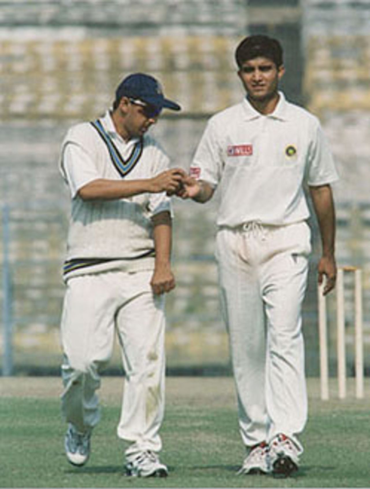 Ganguly being helped by his team mate in shining the ball. Ranji Trophy East Zone League, 2000-01, Bengal v Orissa, Eden Gardens, Calcutta, 28-31 December 2000 (Day 3).