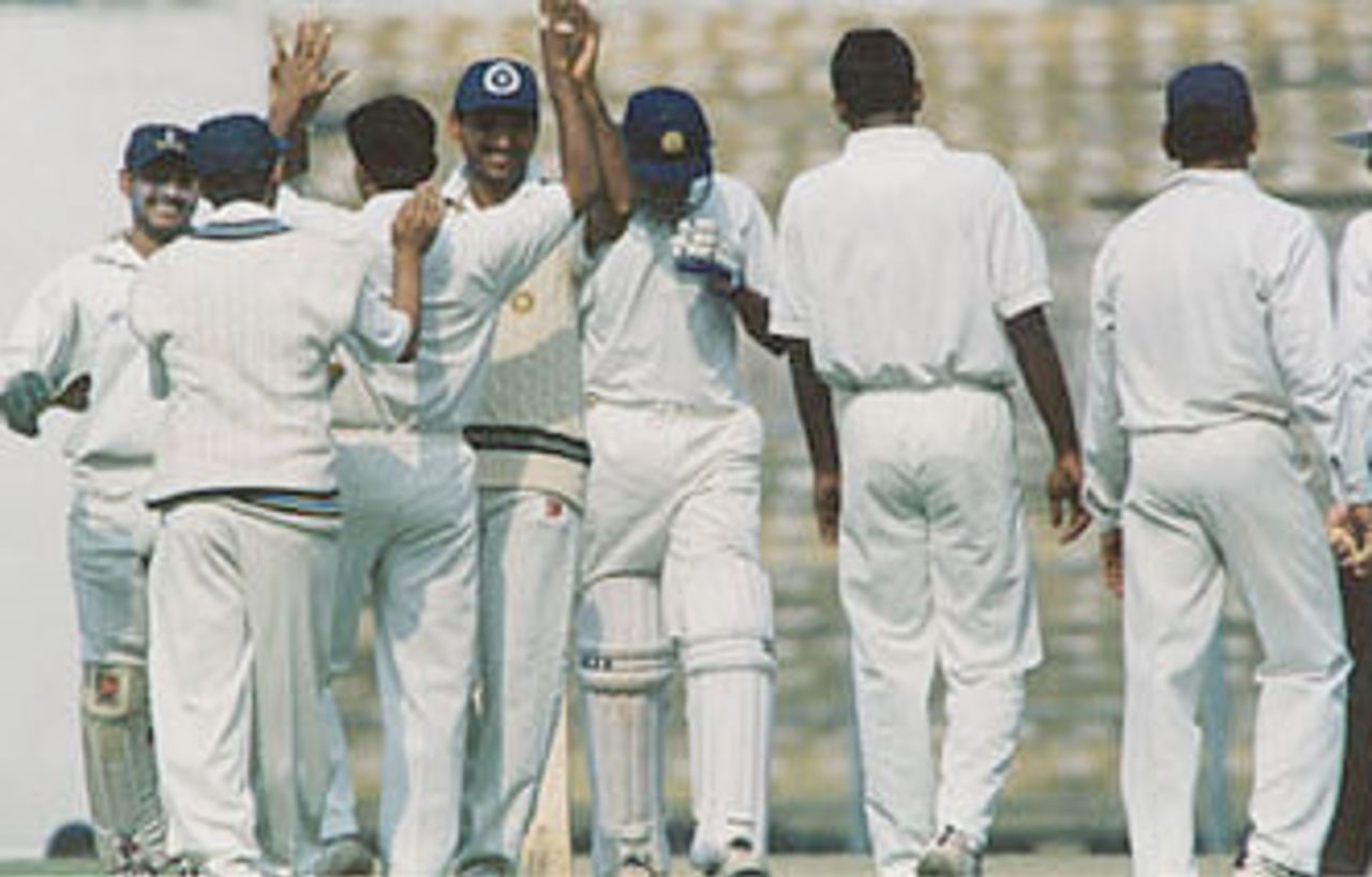 The fielding side celebrate the dismissal of a batsman. Ranji Trophy East Zone League, 2000-01, Bengal v Orissa, Eden Gardens, Calcutta, 28-31 December 2000 (Day 3).