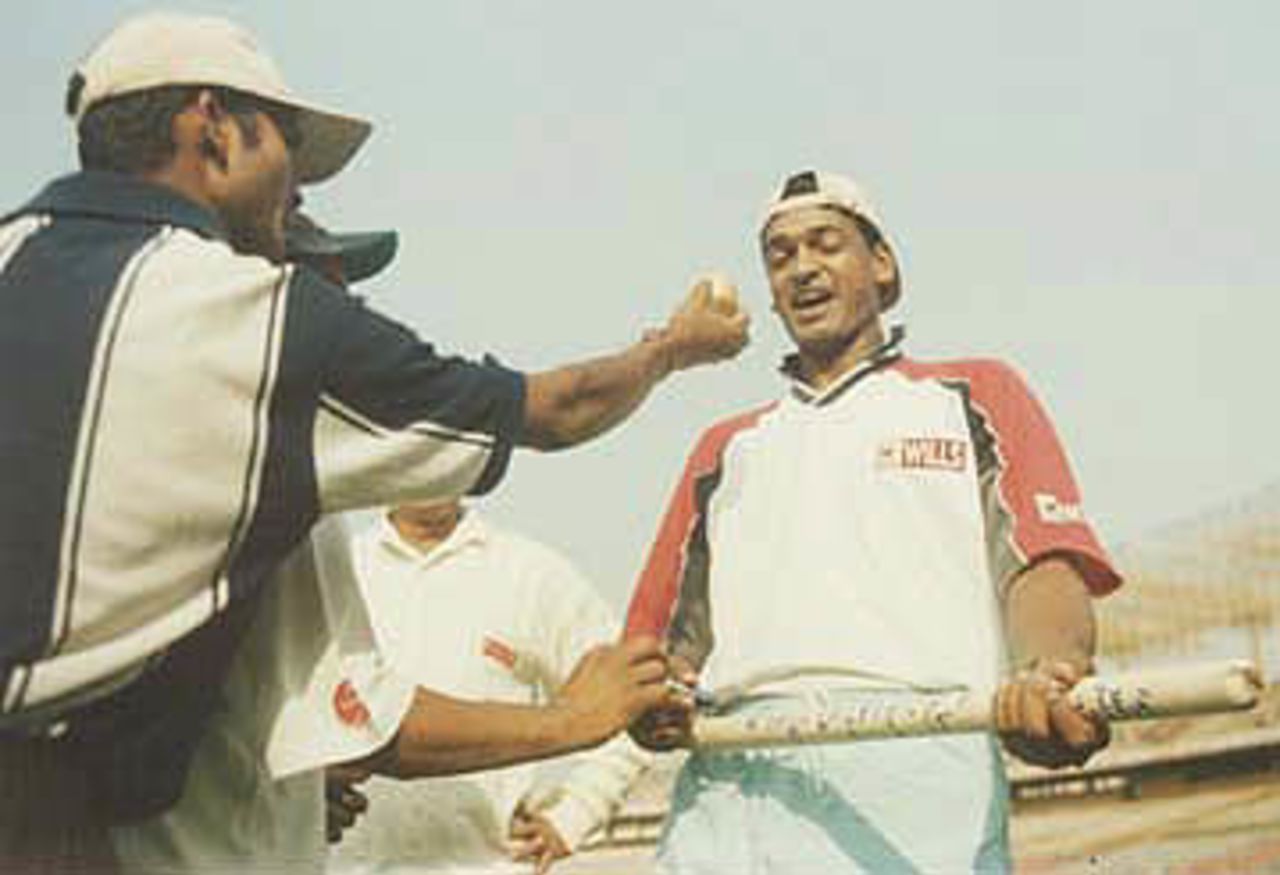 Hero of the match Mohanty being offered a sweet. Ranji Trophy East Zone League, 2000-01, Bengal v Orissa, Eden Gardens, Calcutta, 28-31 December 2000 (Day 4).
