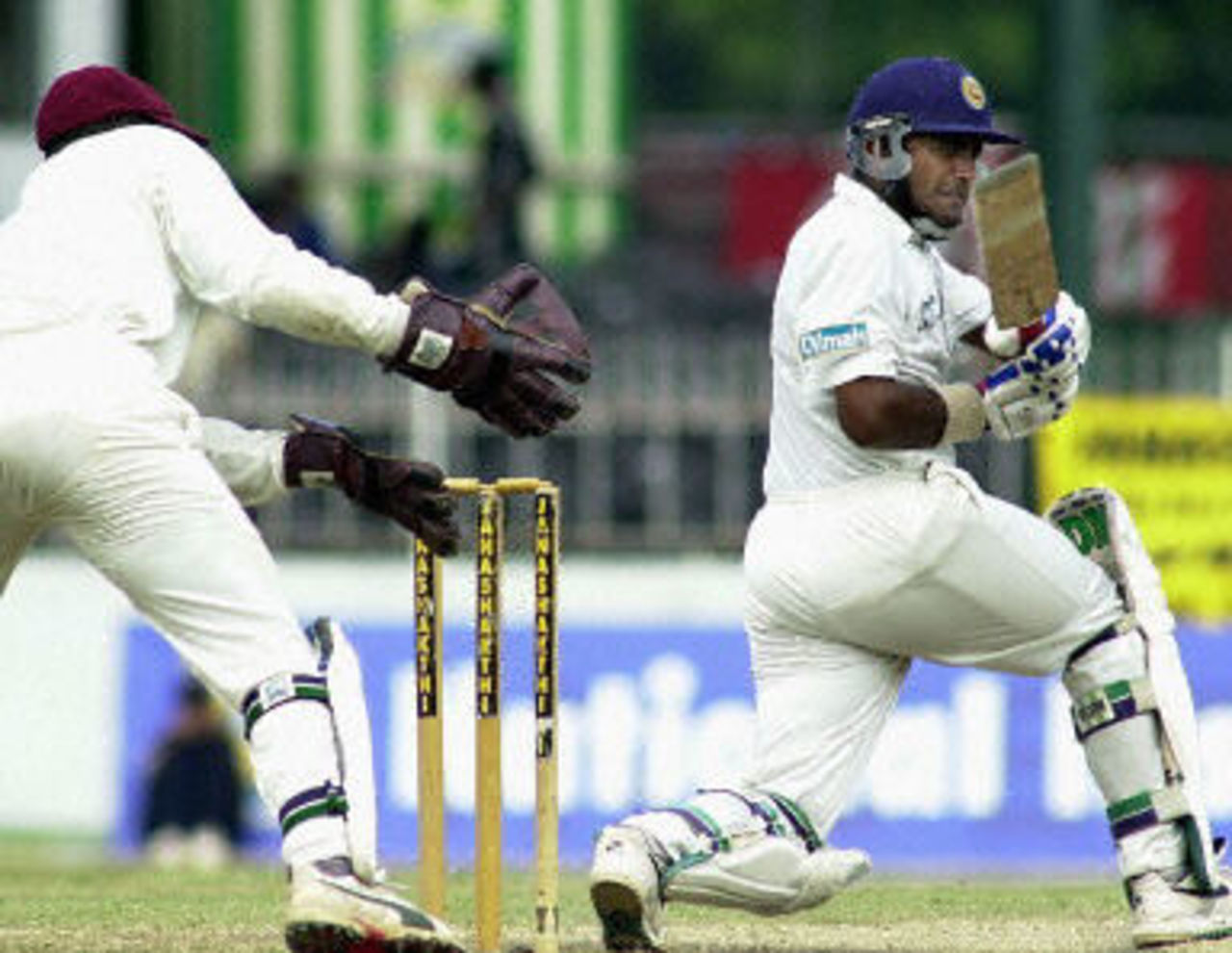 Hashan Tillakaratne sweeps a ball to the boundary during his century