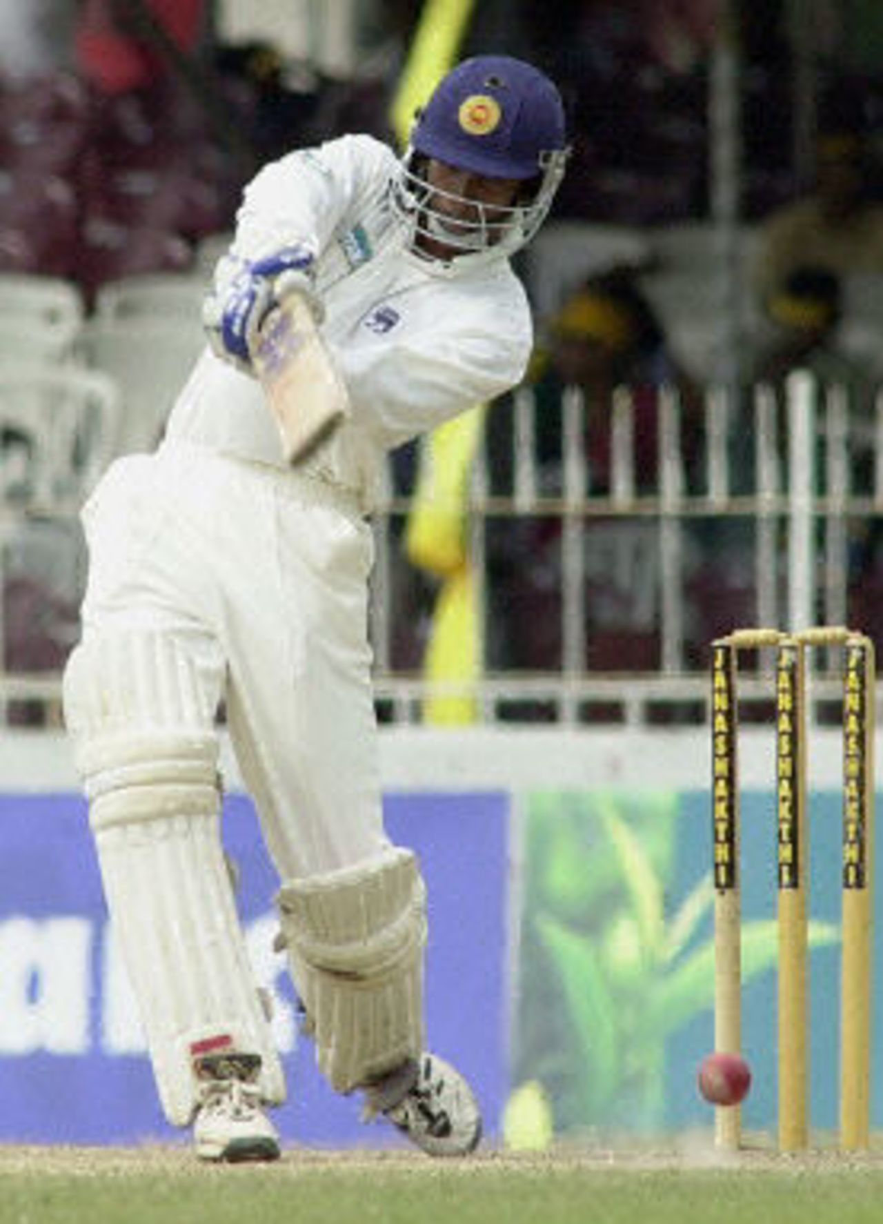 Russel Arnold hits a ball to the boundary for four during his half century