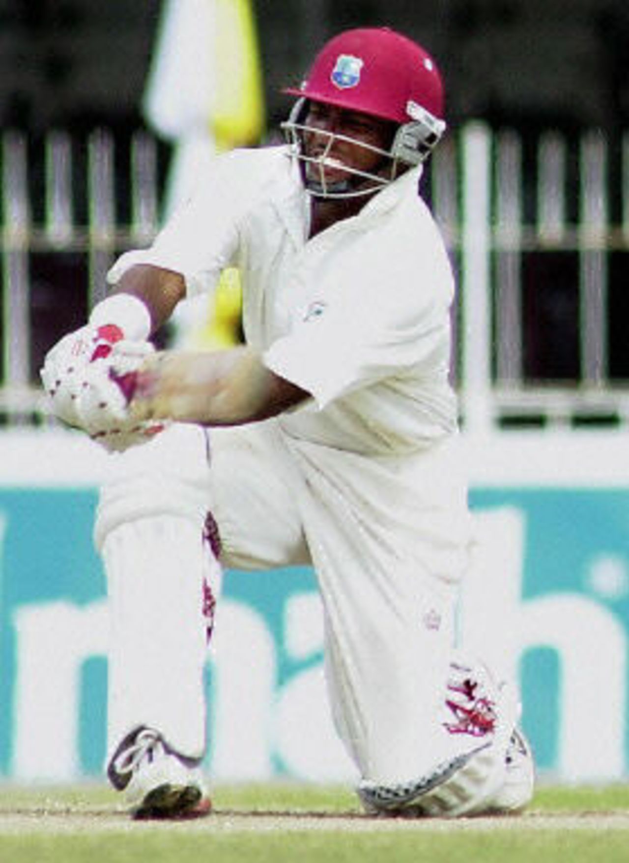 Brian Lara sweeps a ball to the boundary for four during the final day of the final Test match in SSC