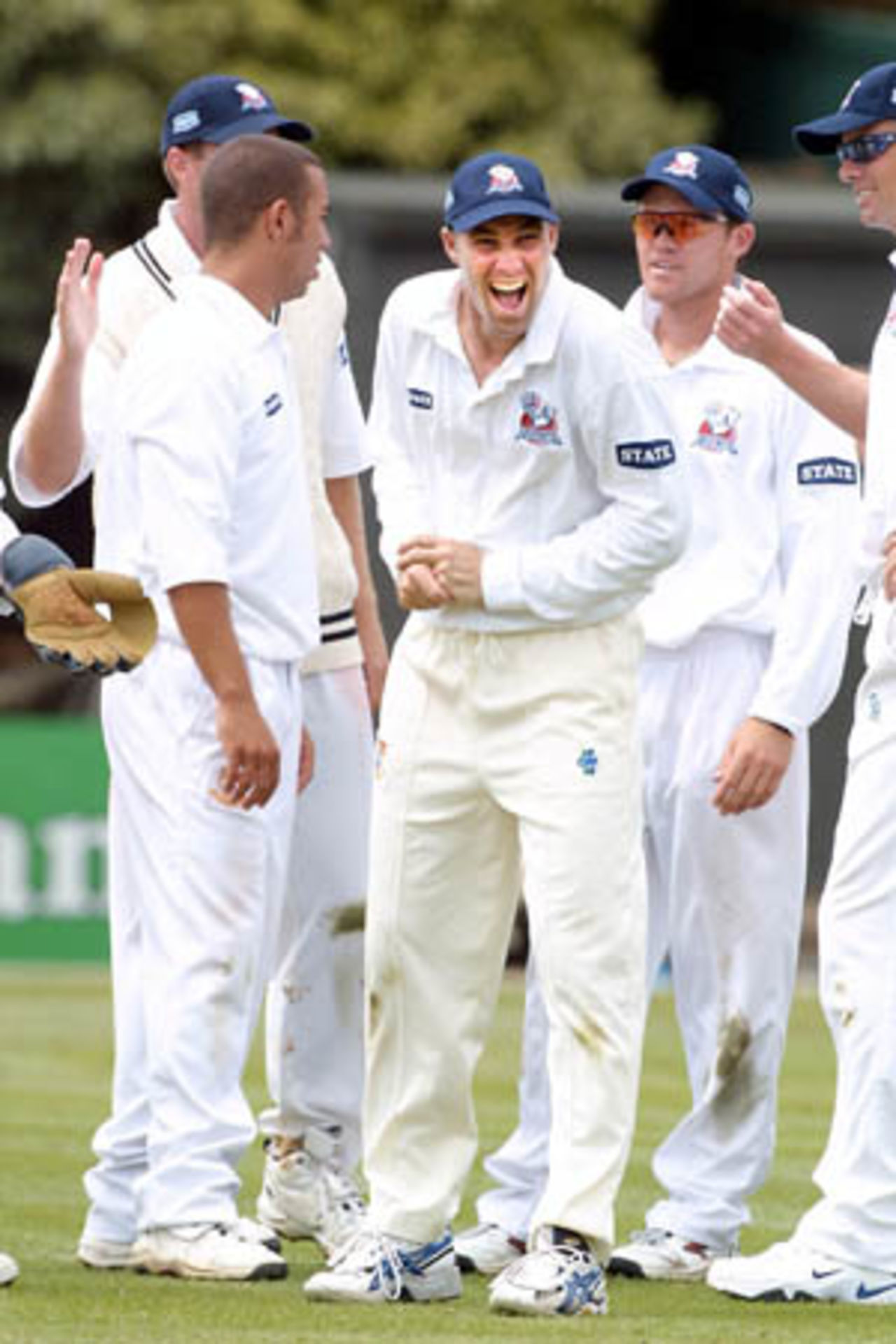 Auckland player Matthew Horne celebrates the dismissal of a Bangladeshi batsman by bowler Andre Adams (left). Also celebrating are Lou Vincent (right) and Chris Drum (far right). Tour match: Auckland v Bangladeshis at Eden Park Outer Oval, Auckland, 12-15 Dec 2001 (12 December 2001).
